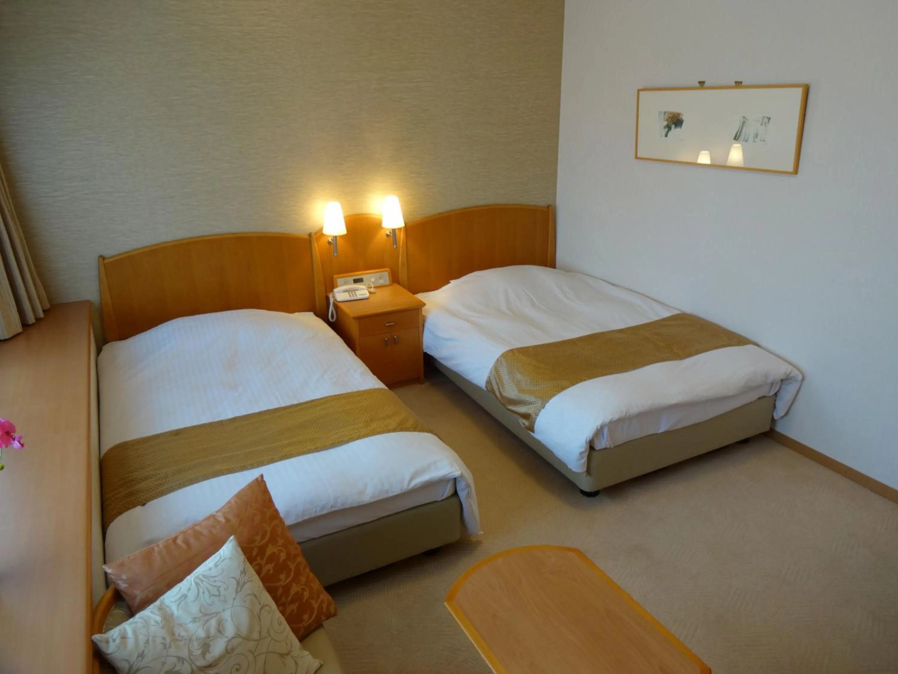 Bed in Kobe Luminous Hotel