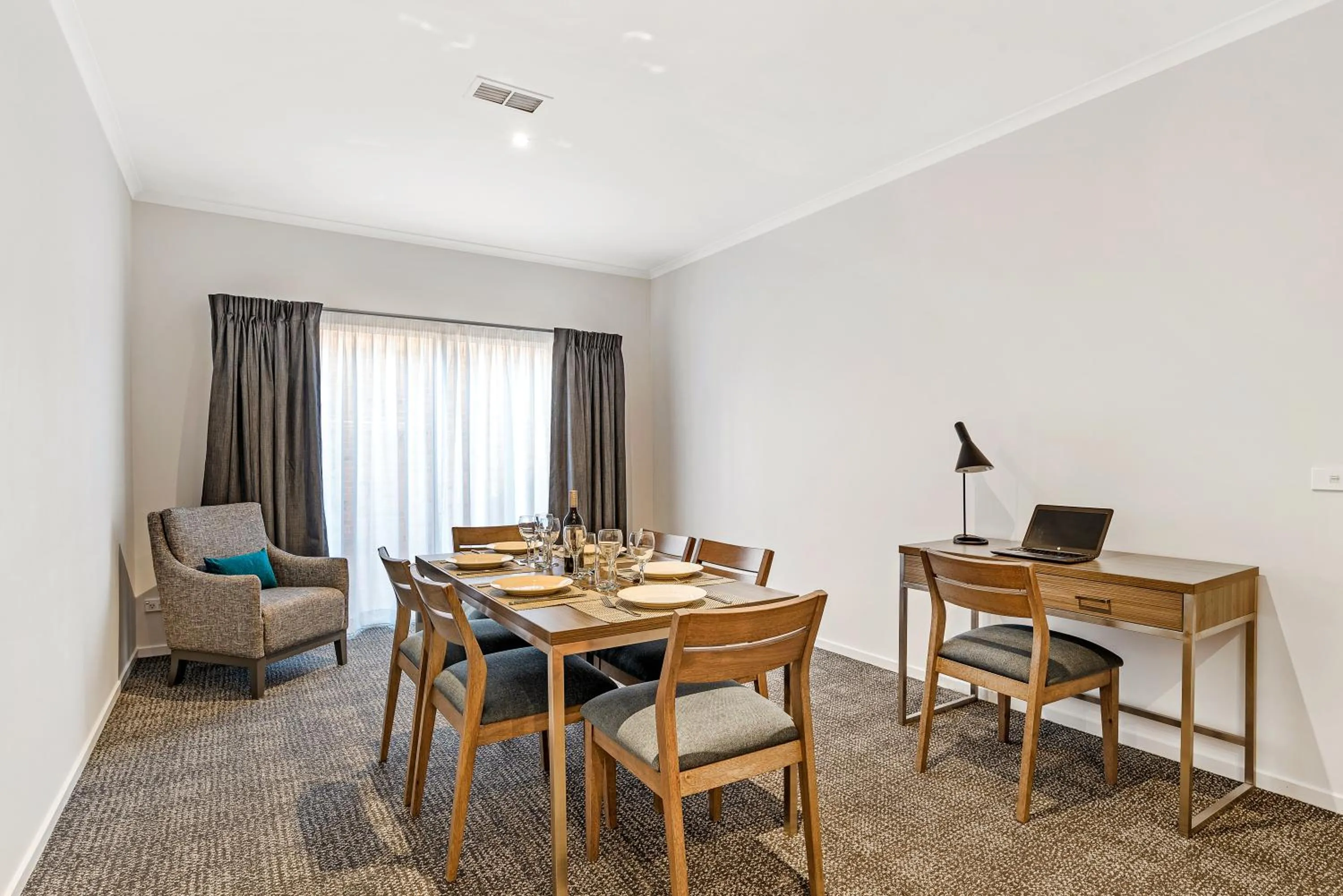 Dining area in Quest Brighton on the Bay