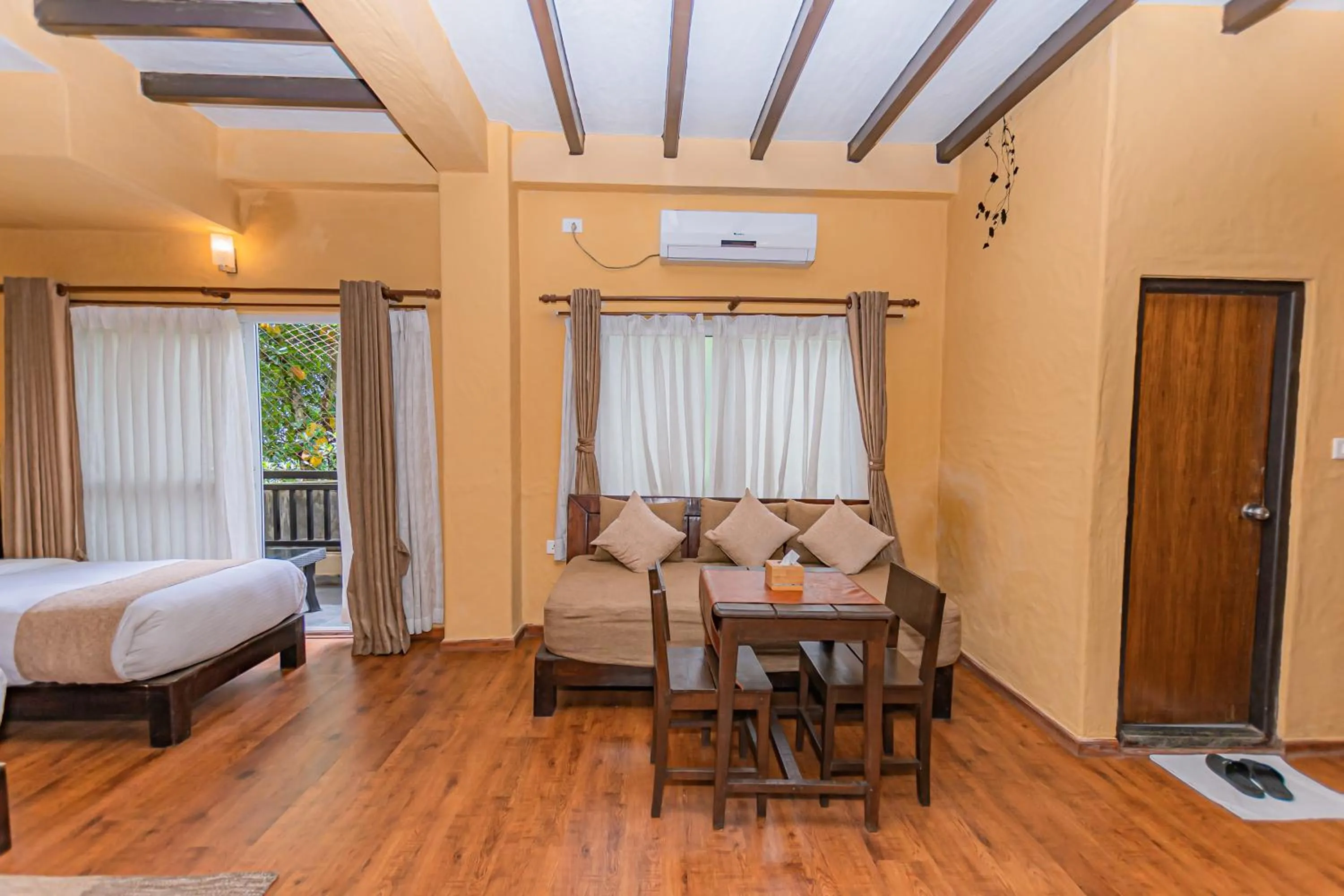 Living room, Bed in Pokhara Boutique Hotel