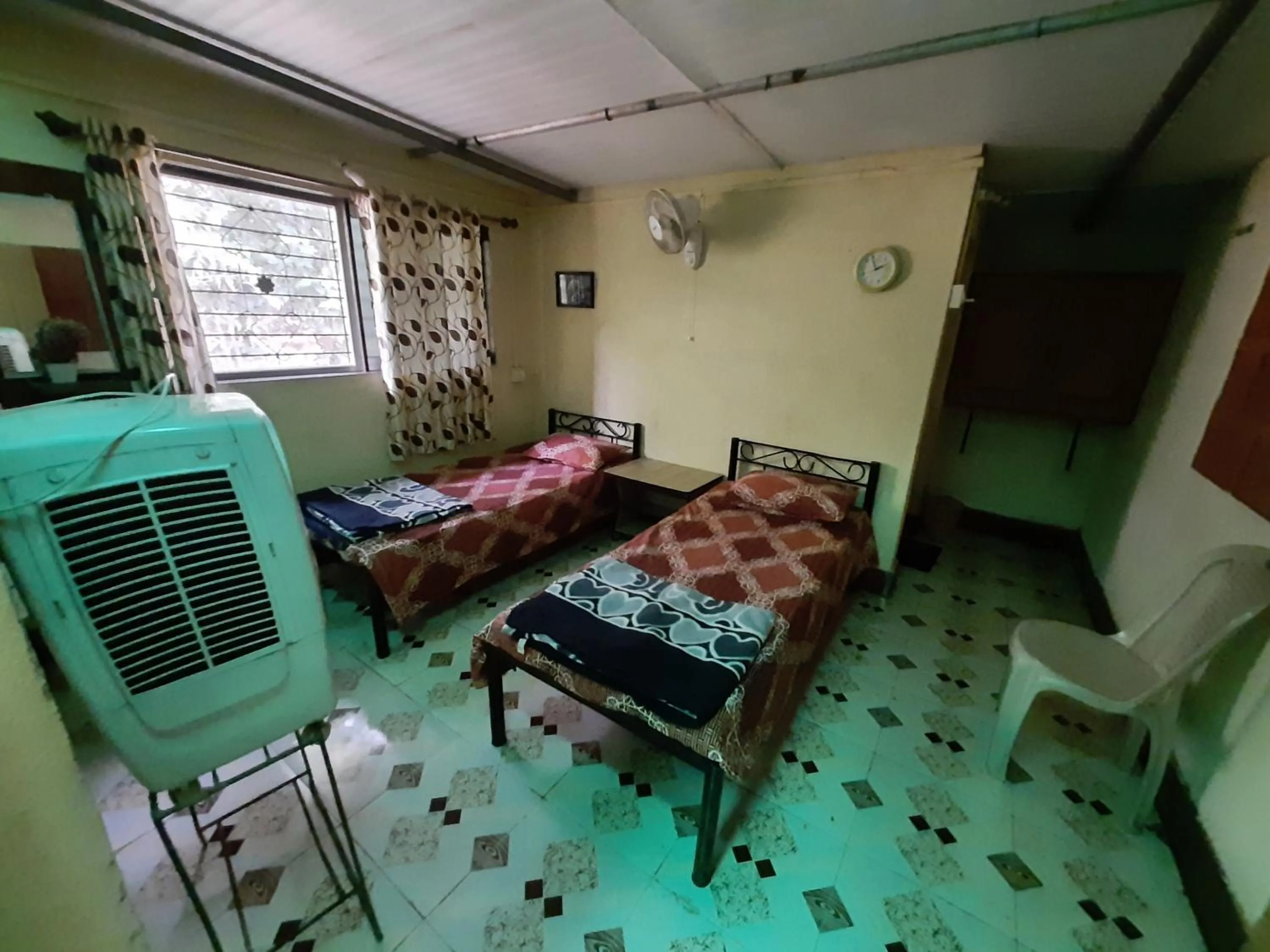 Bed in Vidya Konkan Agro Tourism