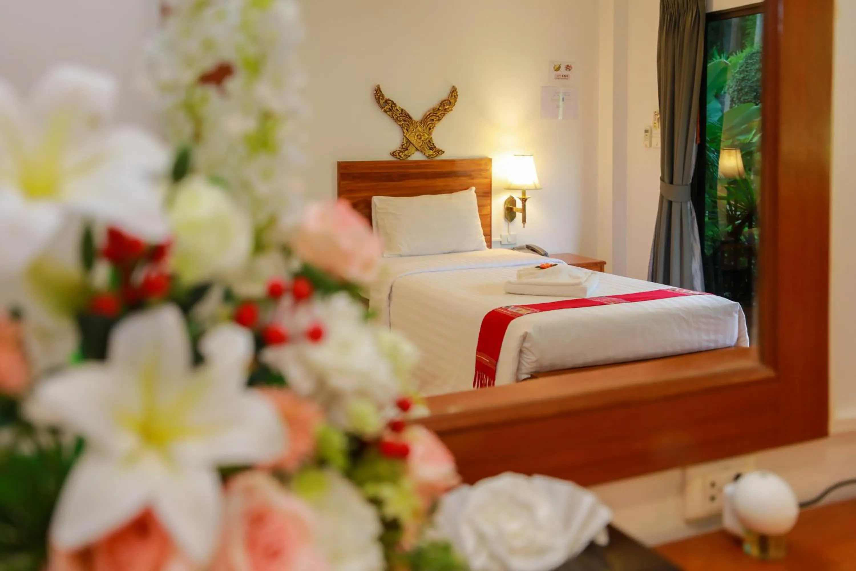 Bed in Baan Vanida Garden Resort