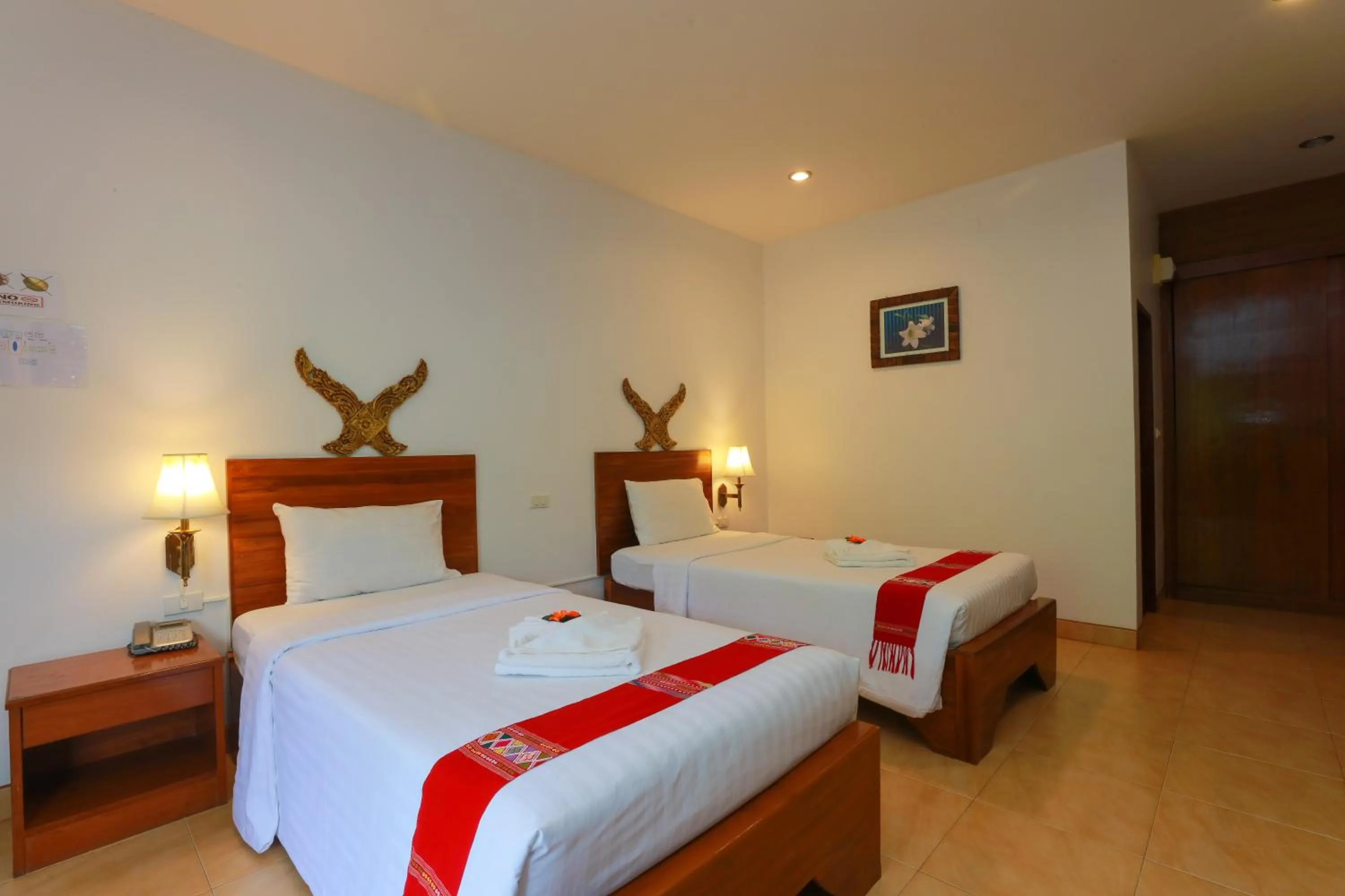 Bed in Baan Vanida Garden Resort