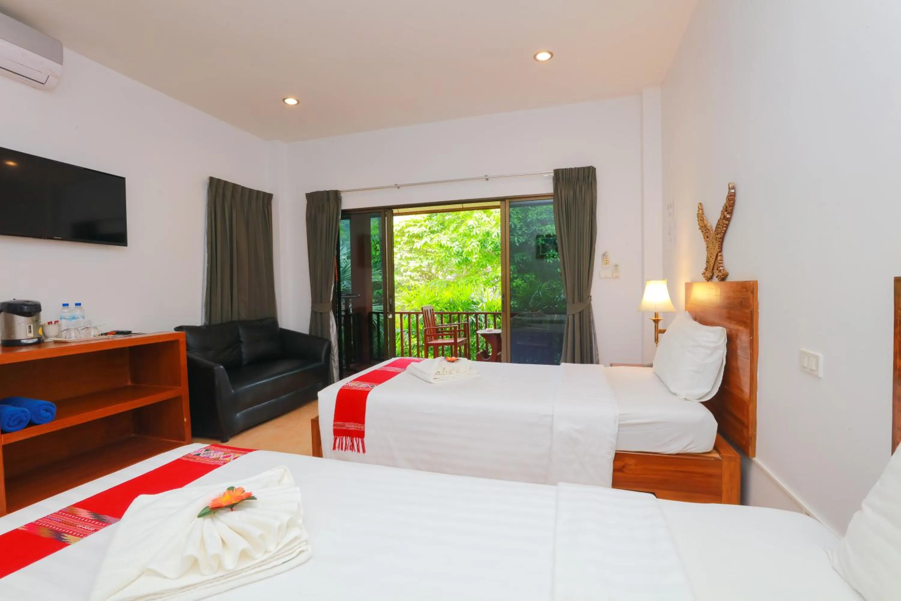Bed in Baan Vanida Garden Resort