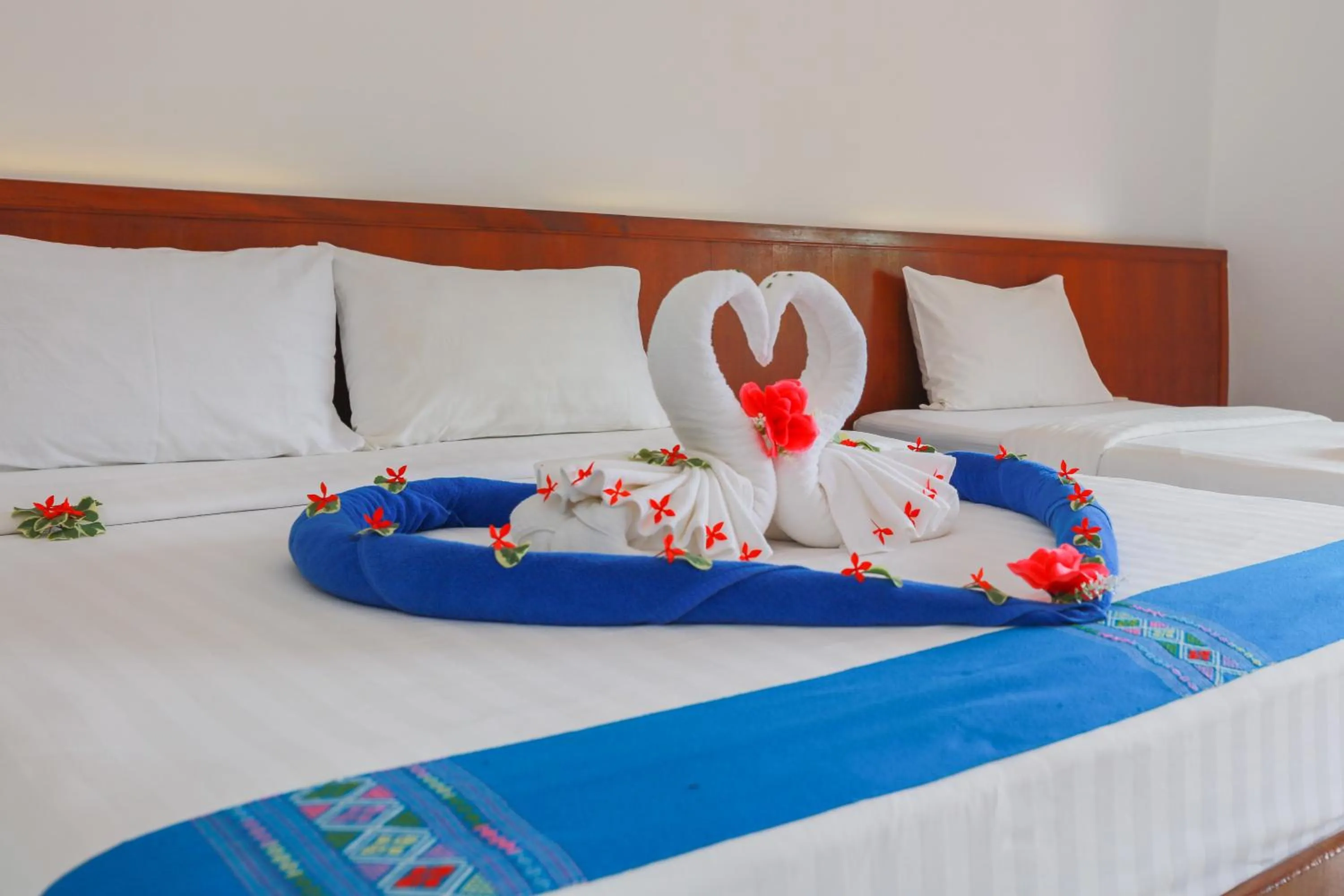 Bed in Baan Vanida Garden Resort