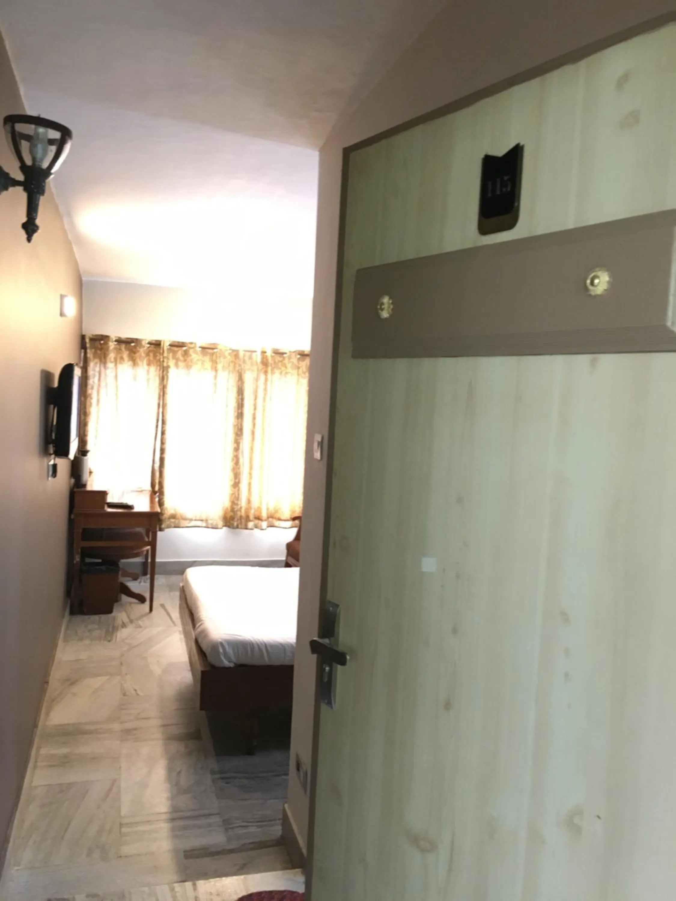 Communal lounge/ TV room, Bed in Hotel Jc Grand