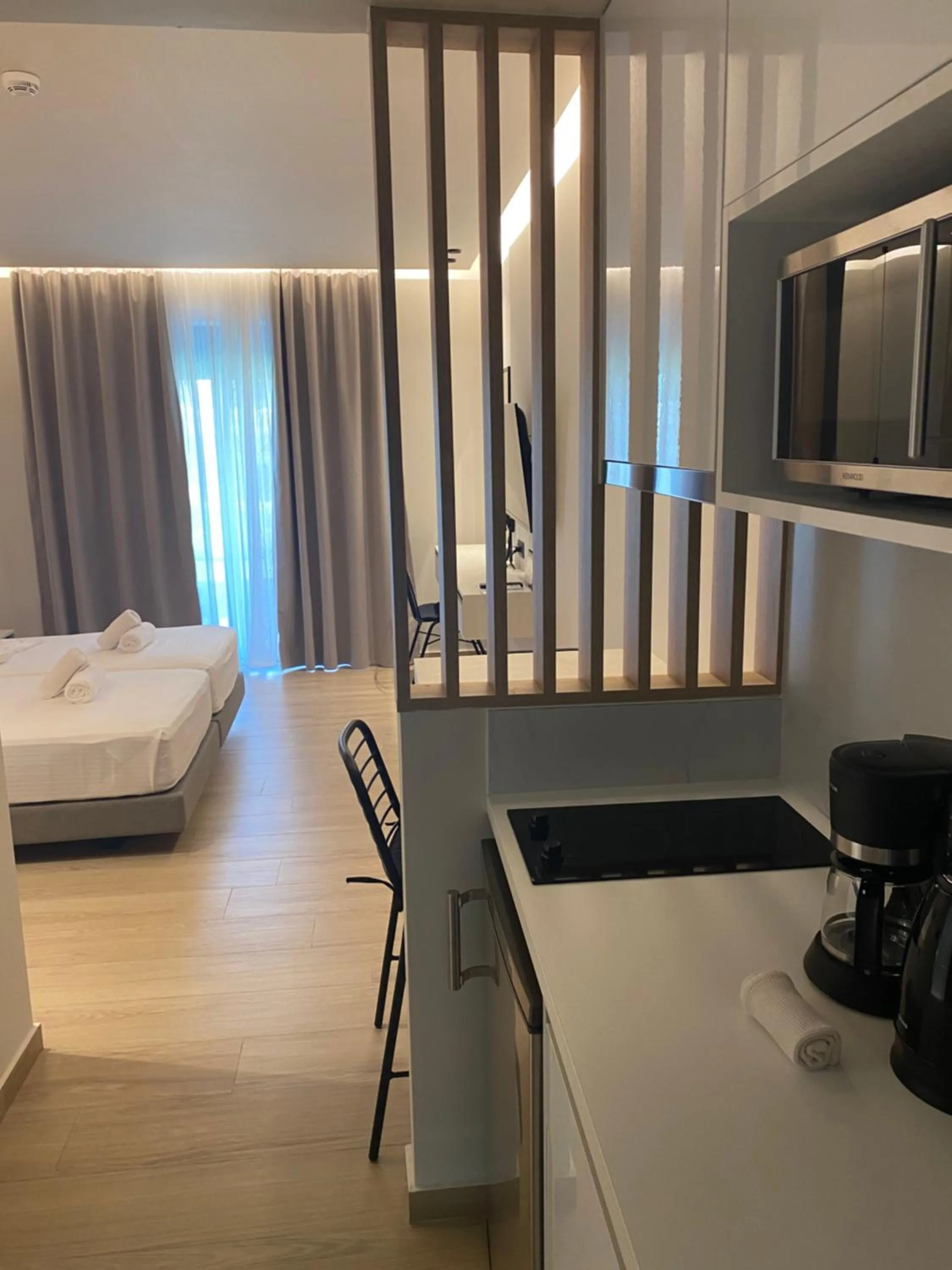 Bed in Barbie Hotel Apartments