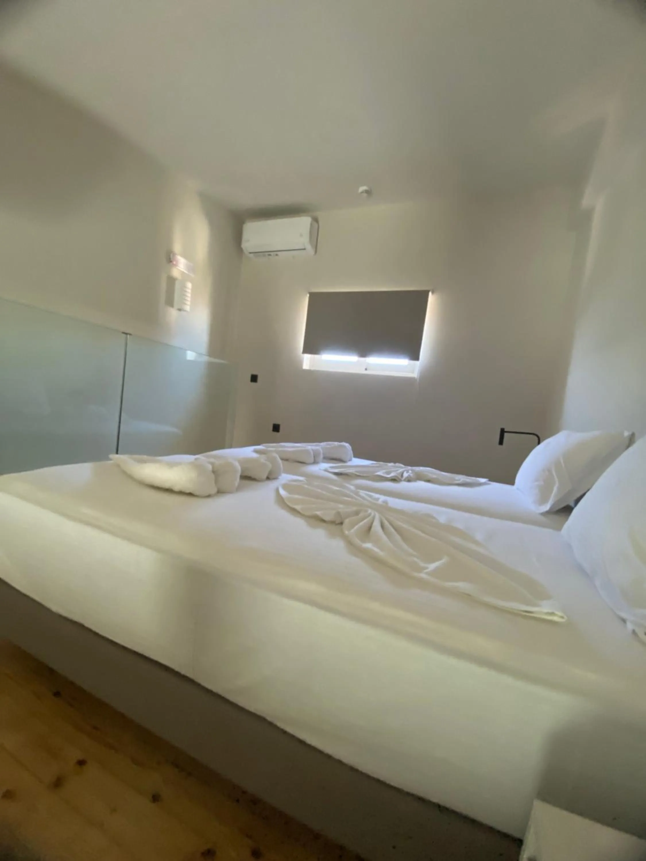 Bed in Barbie Hotel Apartments