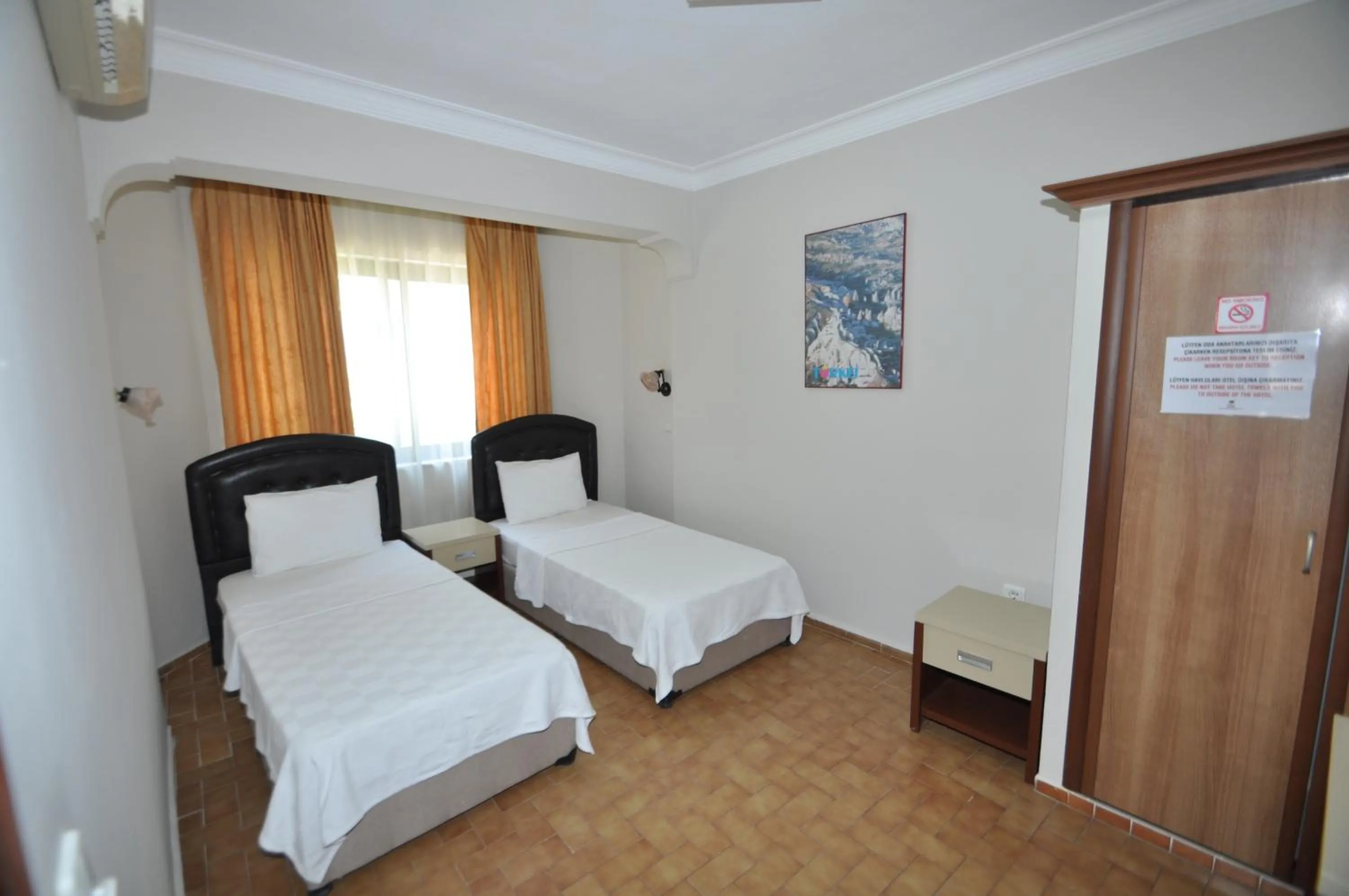 Bed in Defne & Zevkim Hotel