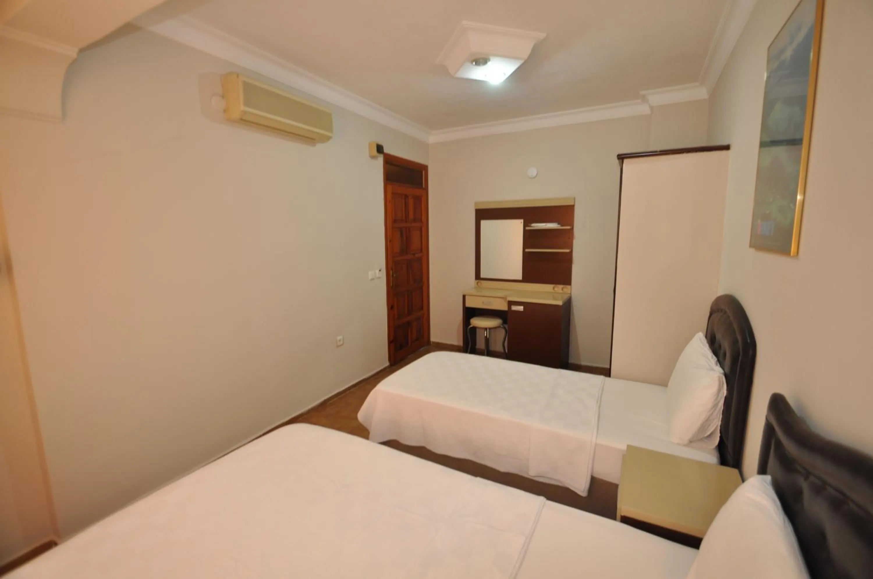 Bed in Defne & Zevkim Hotel