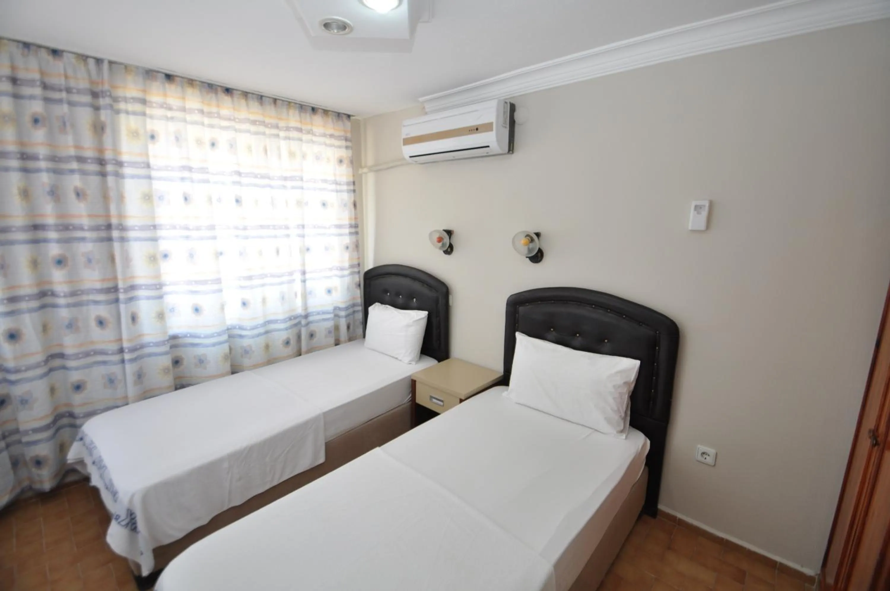 Bed in Defne & Zevkim Hotel
