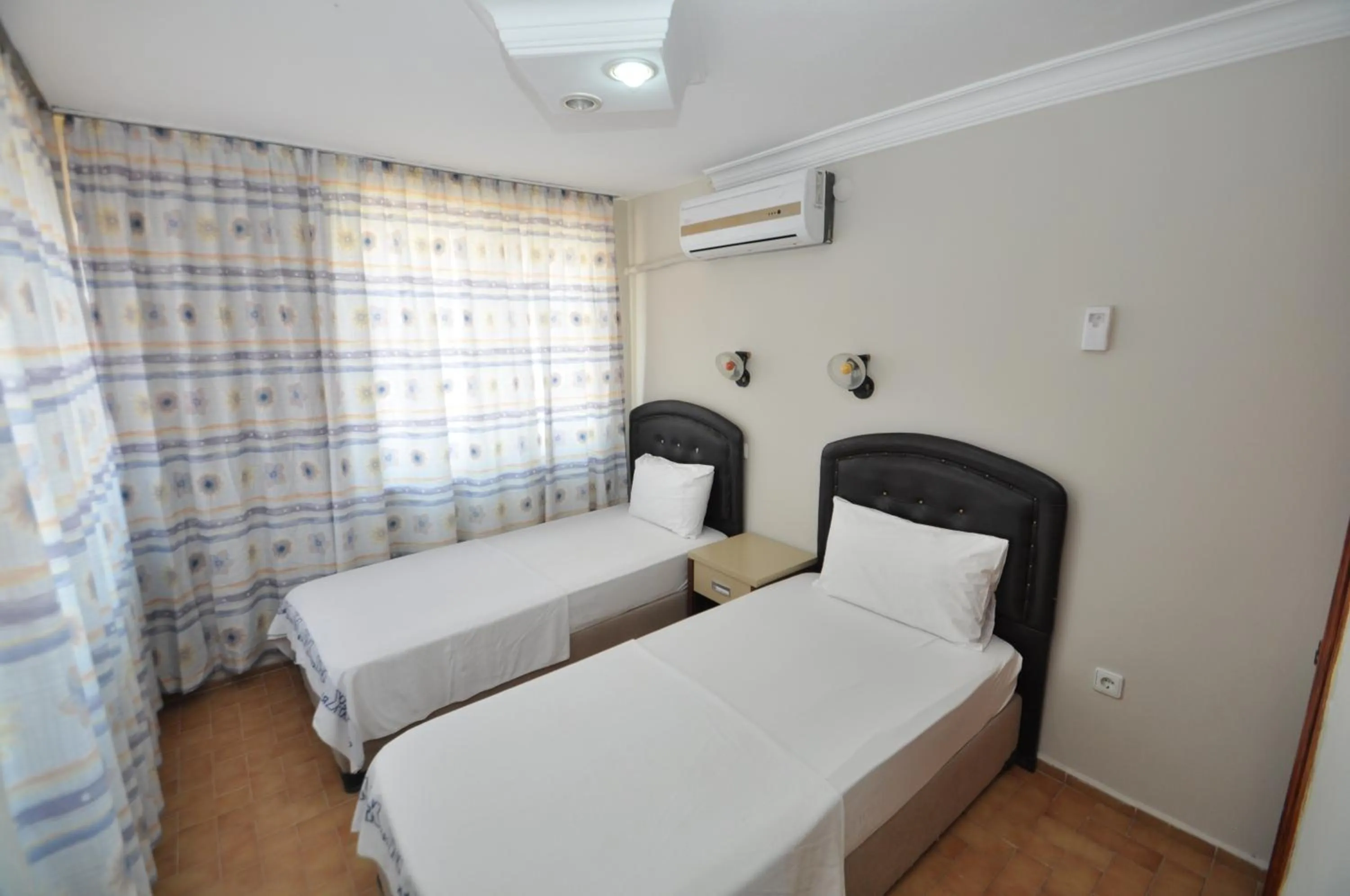 Bed in Defne & Zevkim Hotel