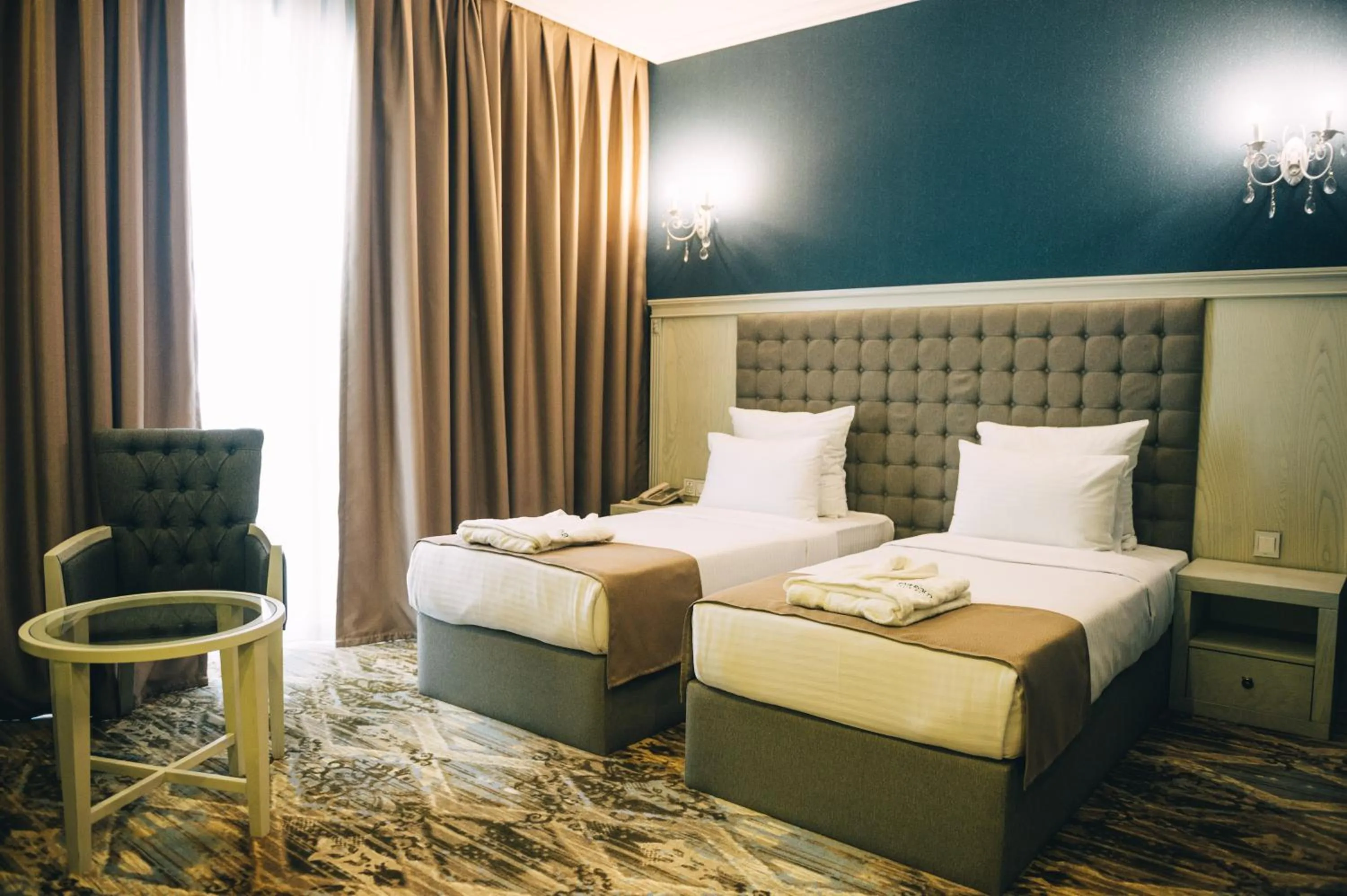 Bed in Emerald Suite Hotel