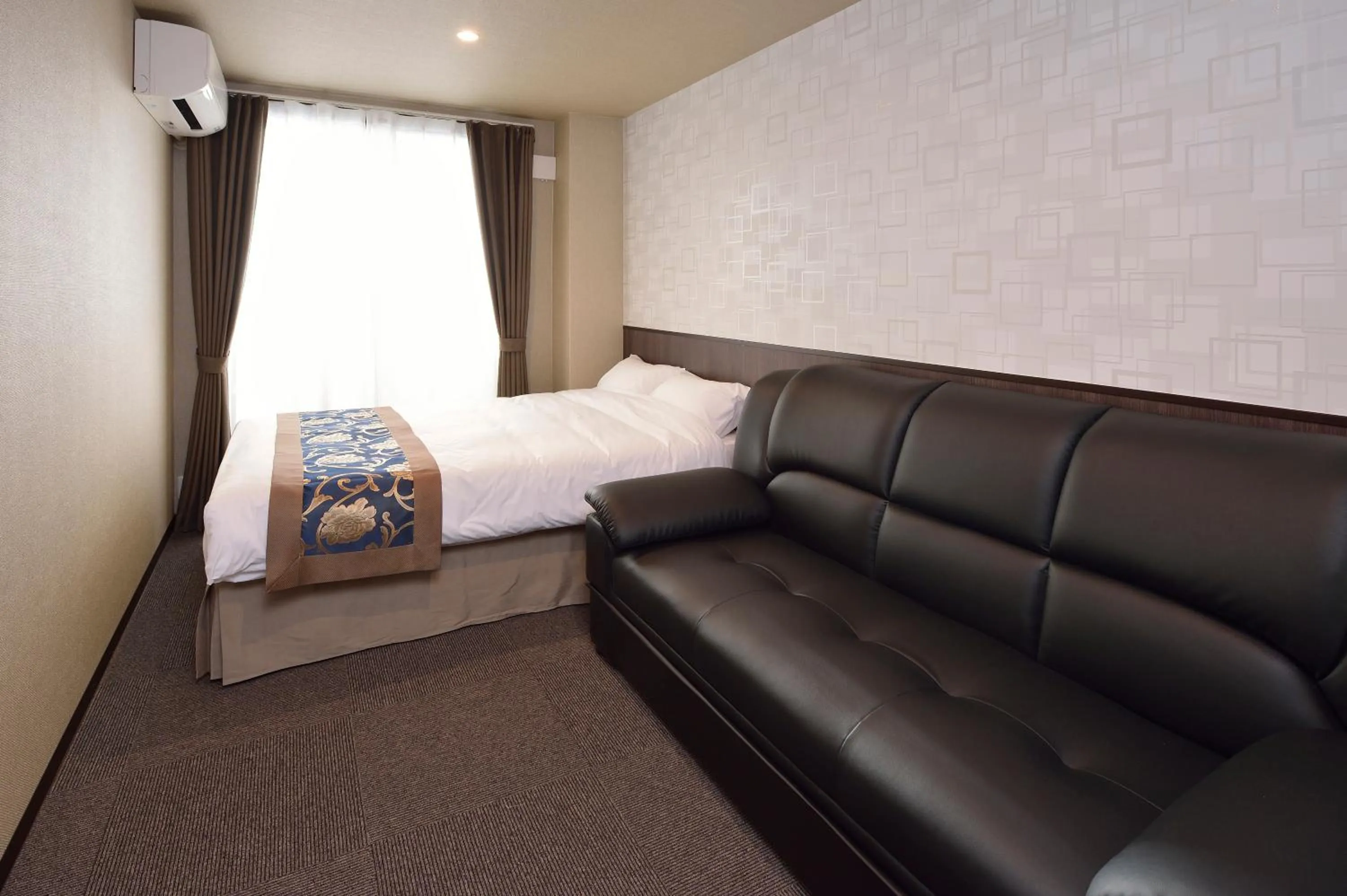 Seating area, Bed in UU Inn Kyoto