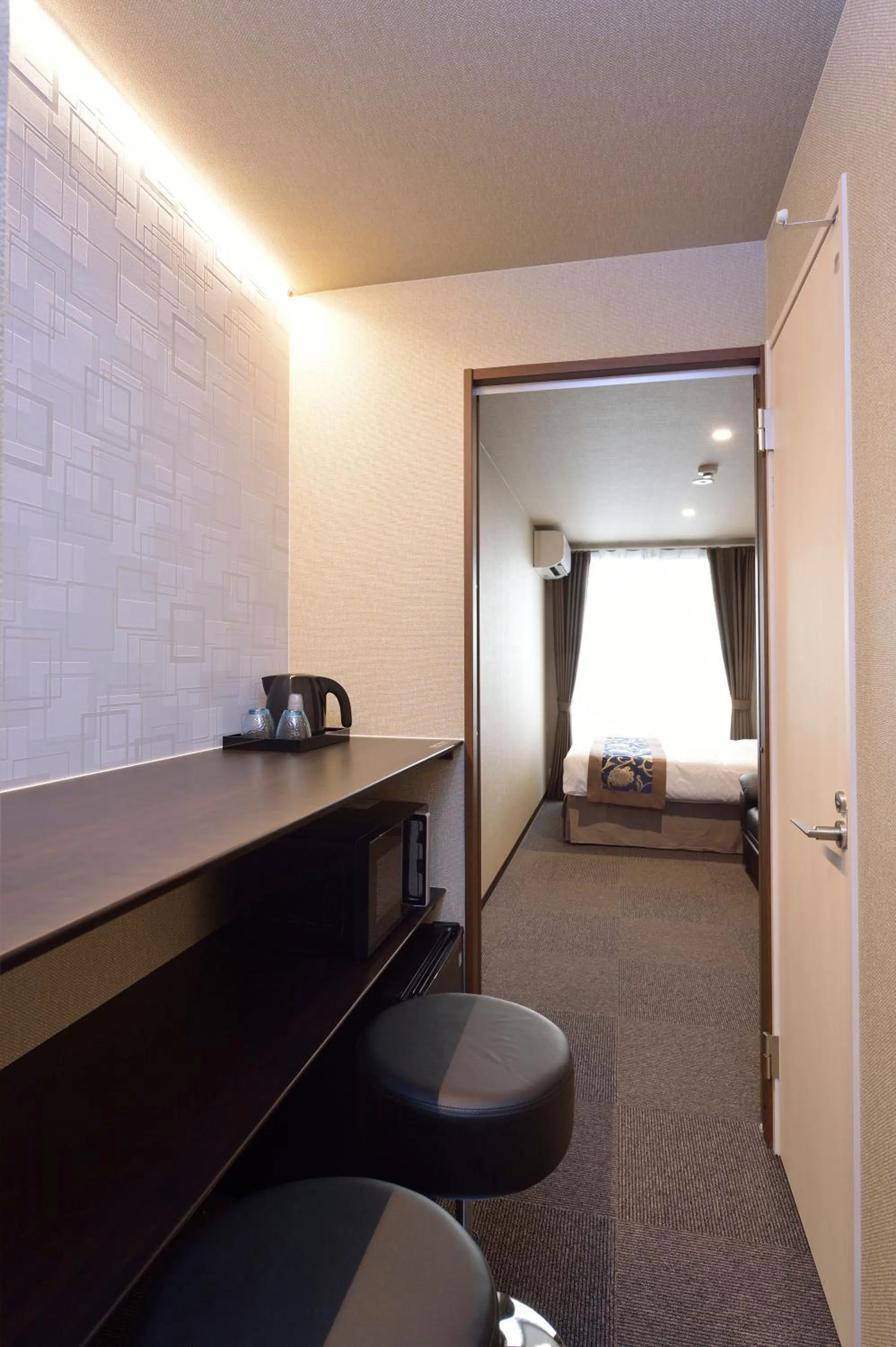 Seating area, Bed in UU Inn Kyoto