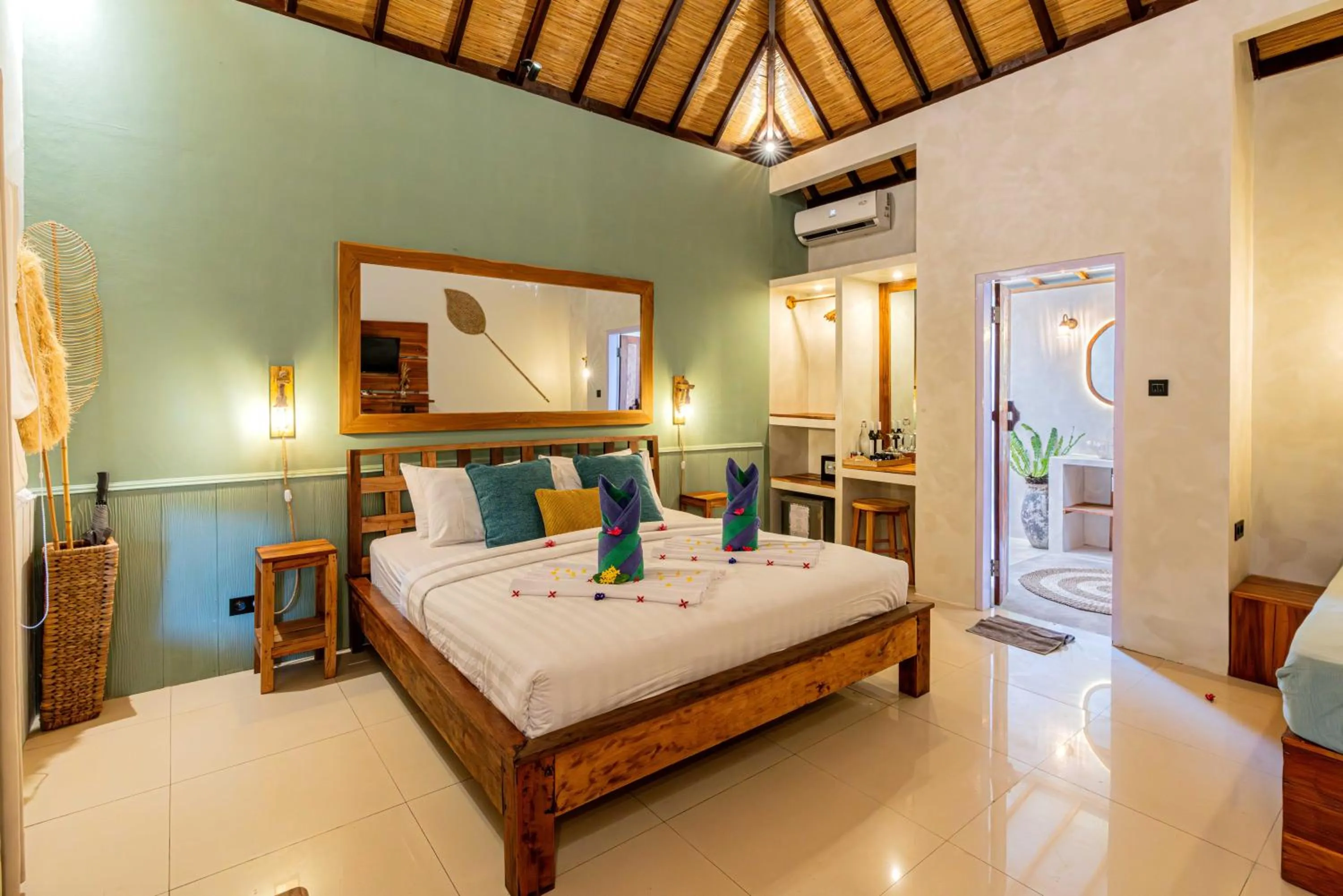Bed in Bale Sampan Boutique Bungalows