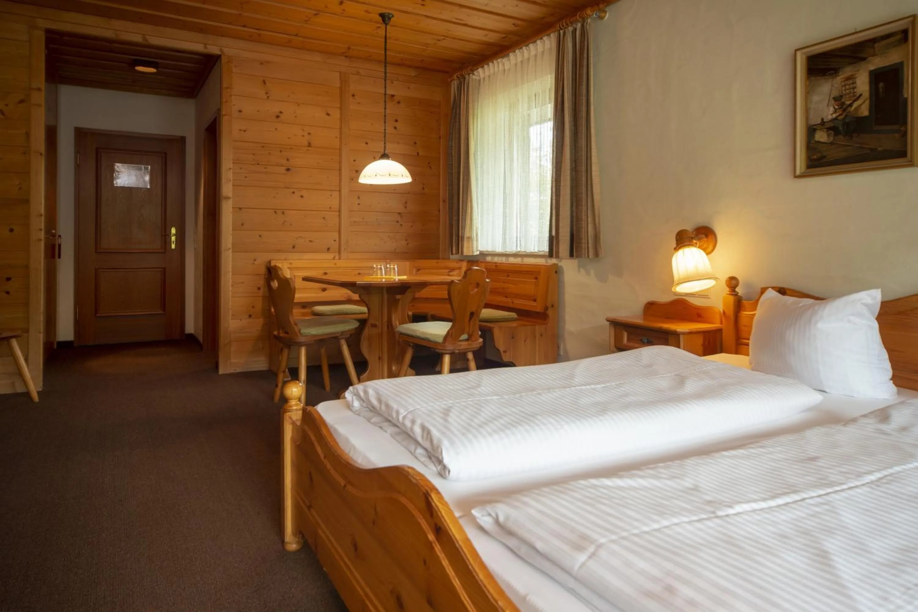 Photo of the whole room, Bed in Seehotel Weissensee