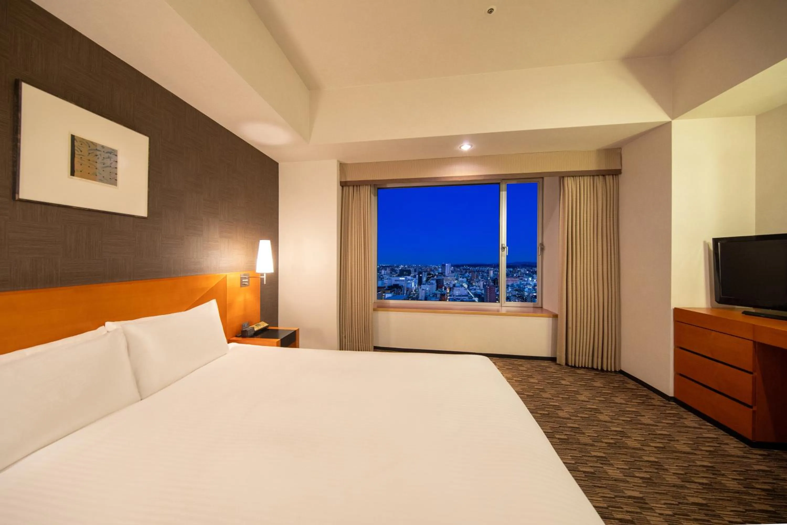 City view, Bed in Hotel Nikko Oita Oasis Tower