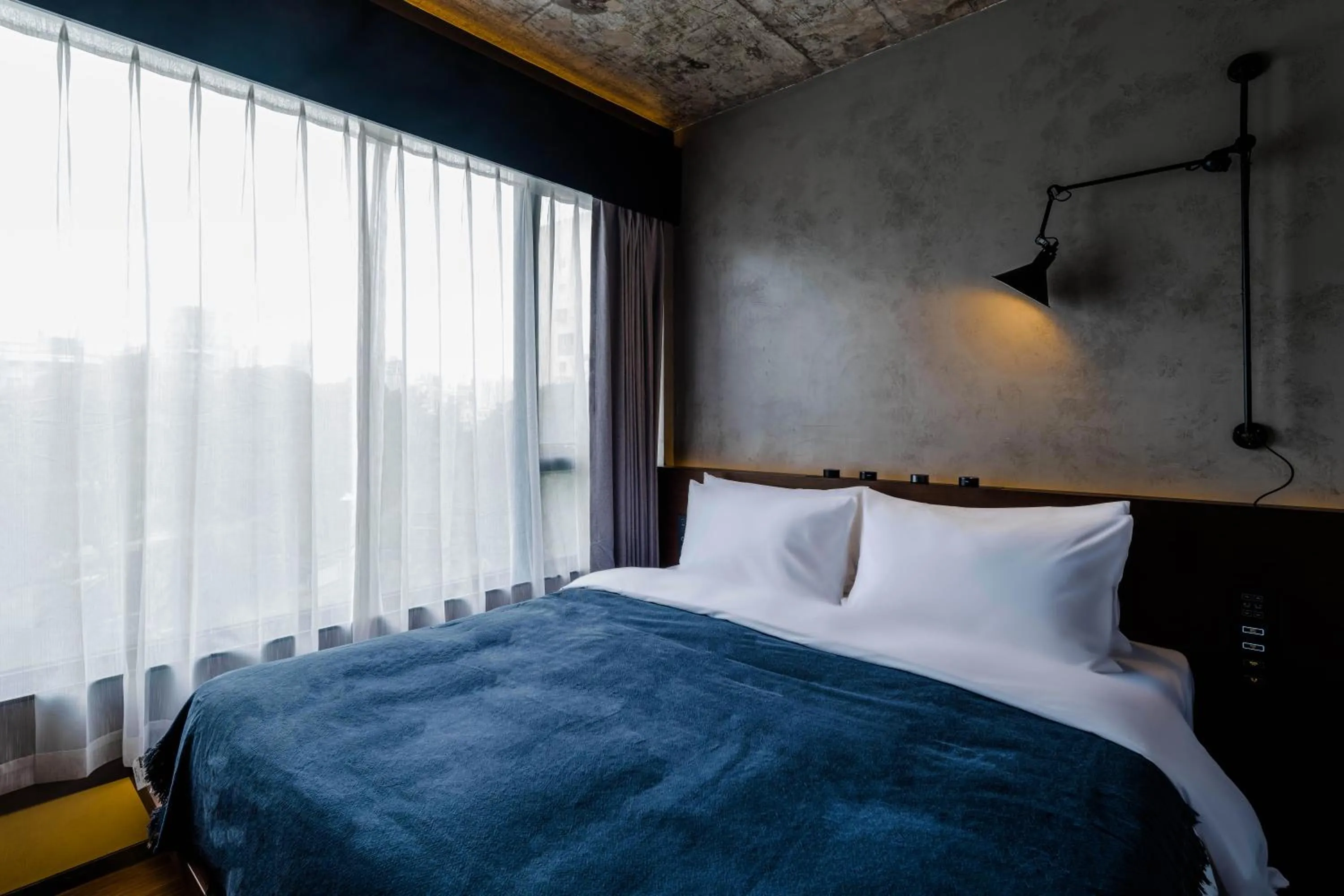 Bed in Neobridge Hotel