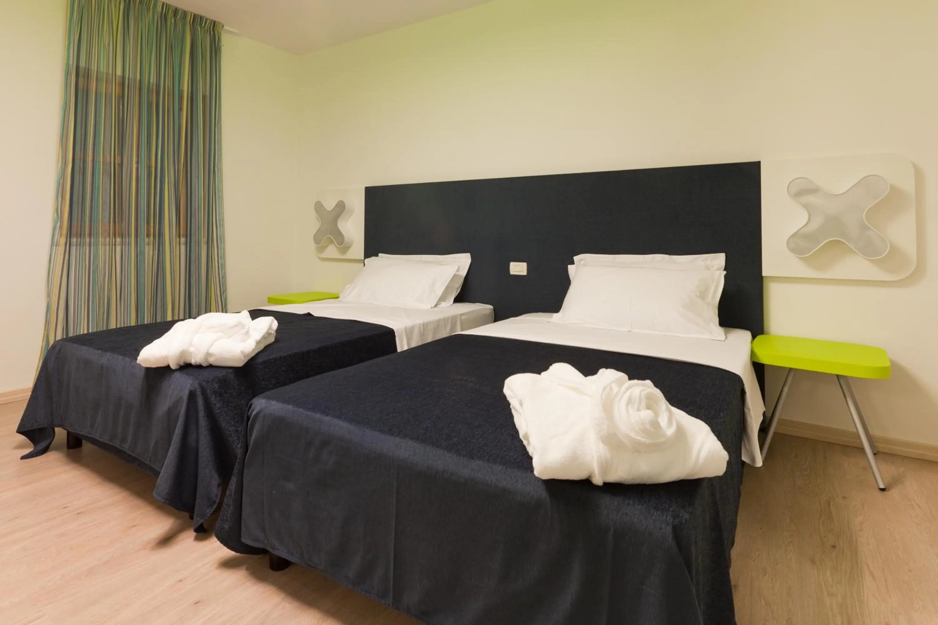 Bed in VELANERA Hotel & Restaurant