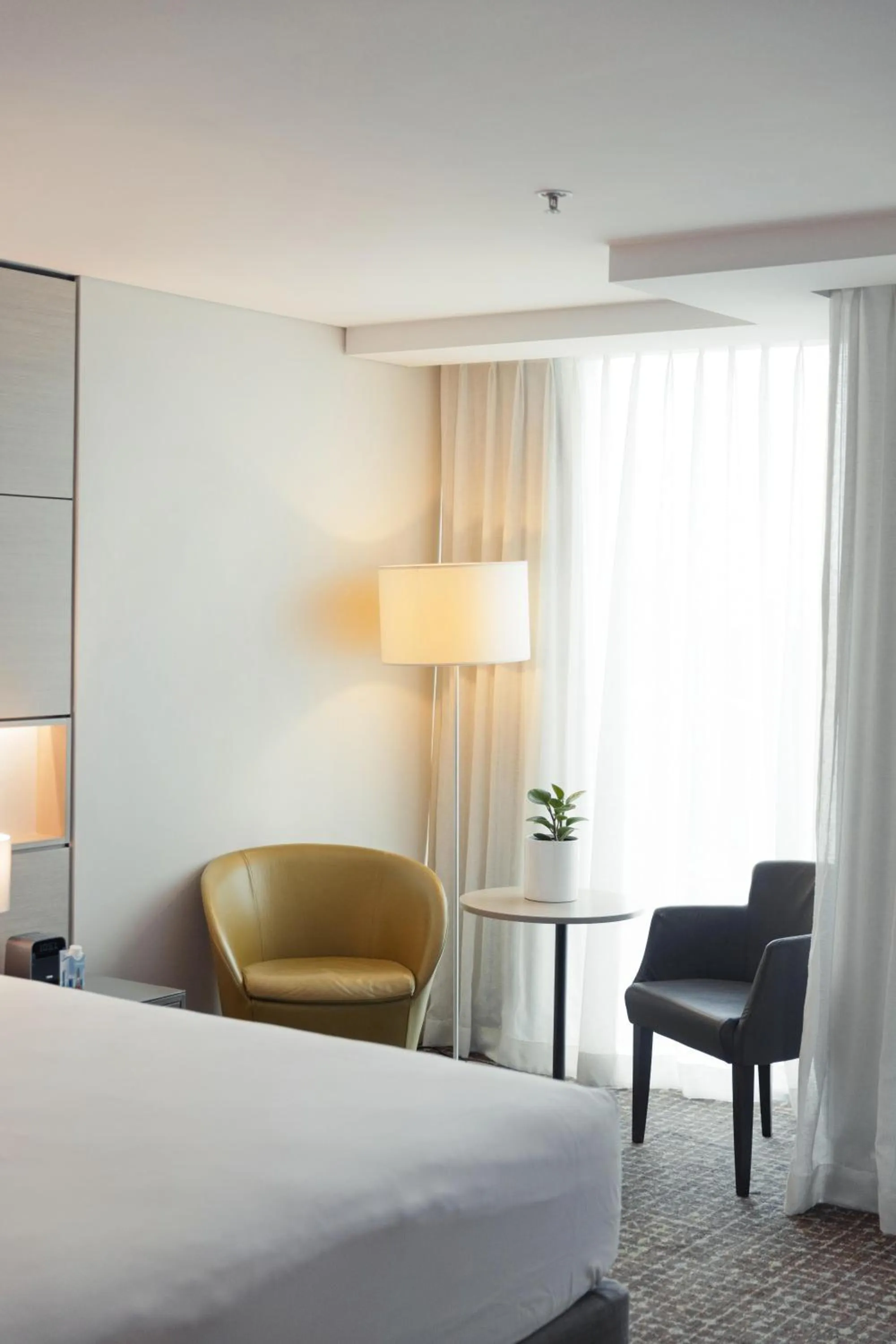 Seating area, Bed in The Point Brisbane Hotel