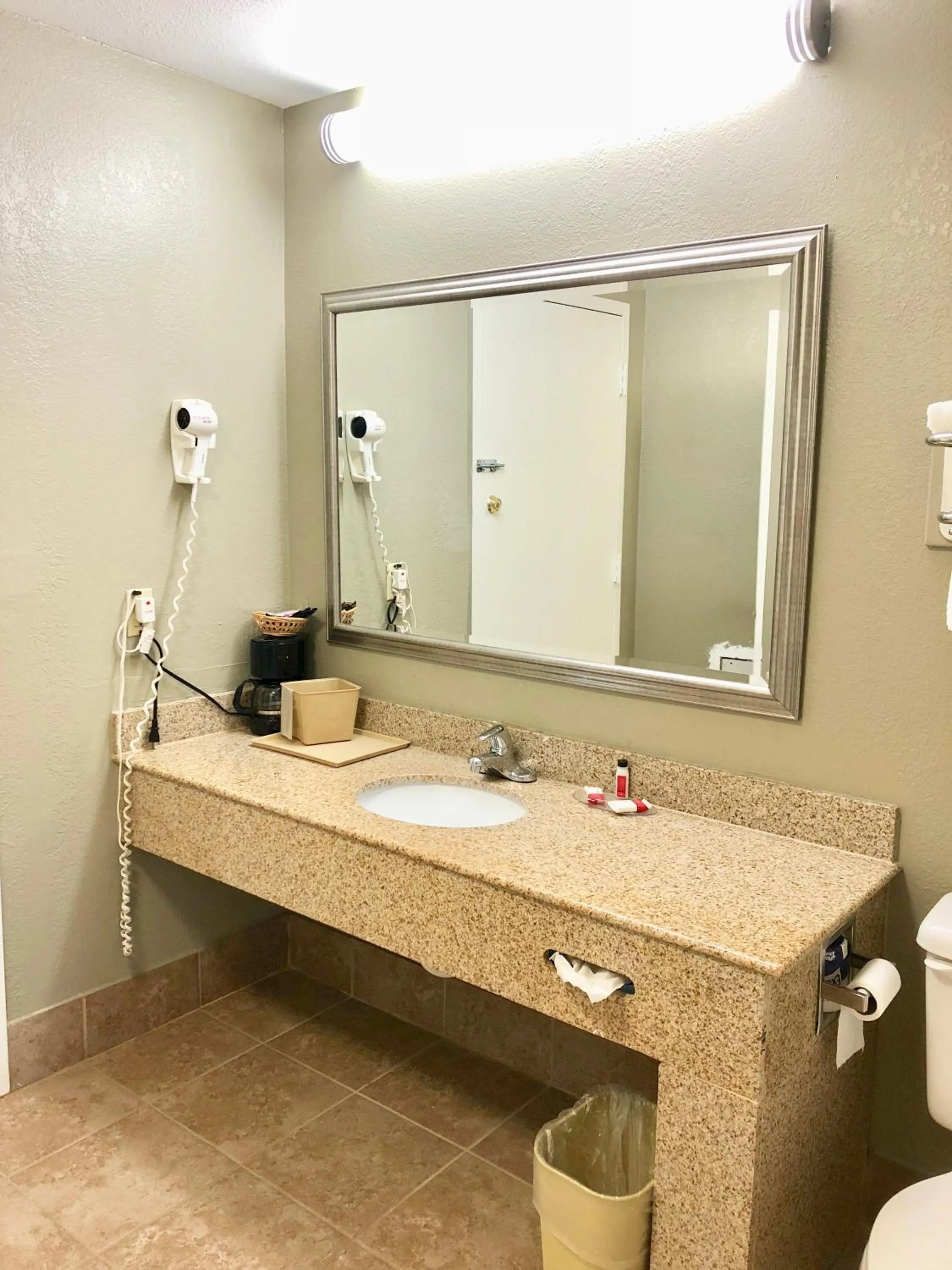 Bathroom in Super 8 by Wyndham Tupelo Airport