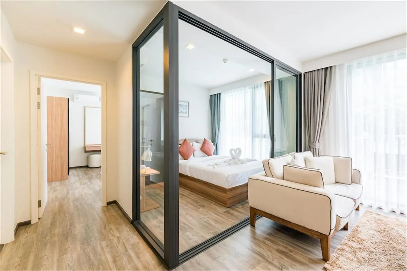 Living room, Bed in The Deck Patong by VIP