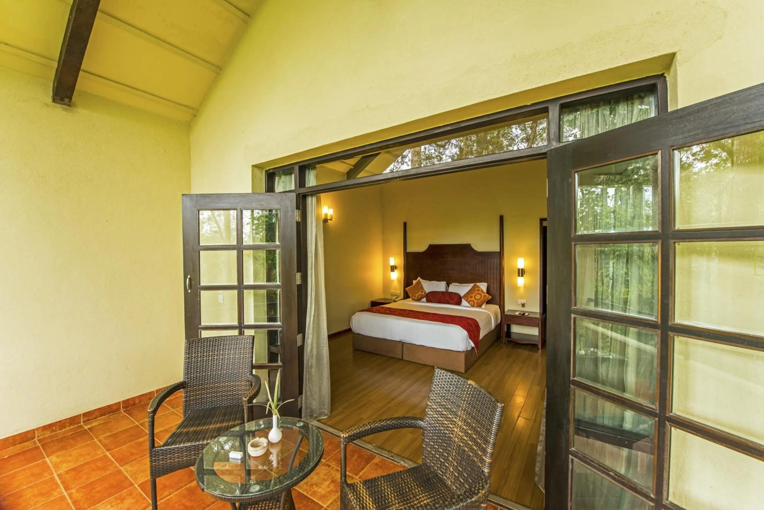 Seating area, Bed in The Windflower Resort & Spa, Coorg