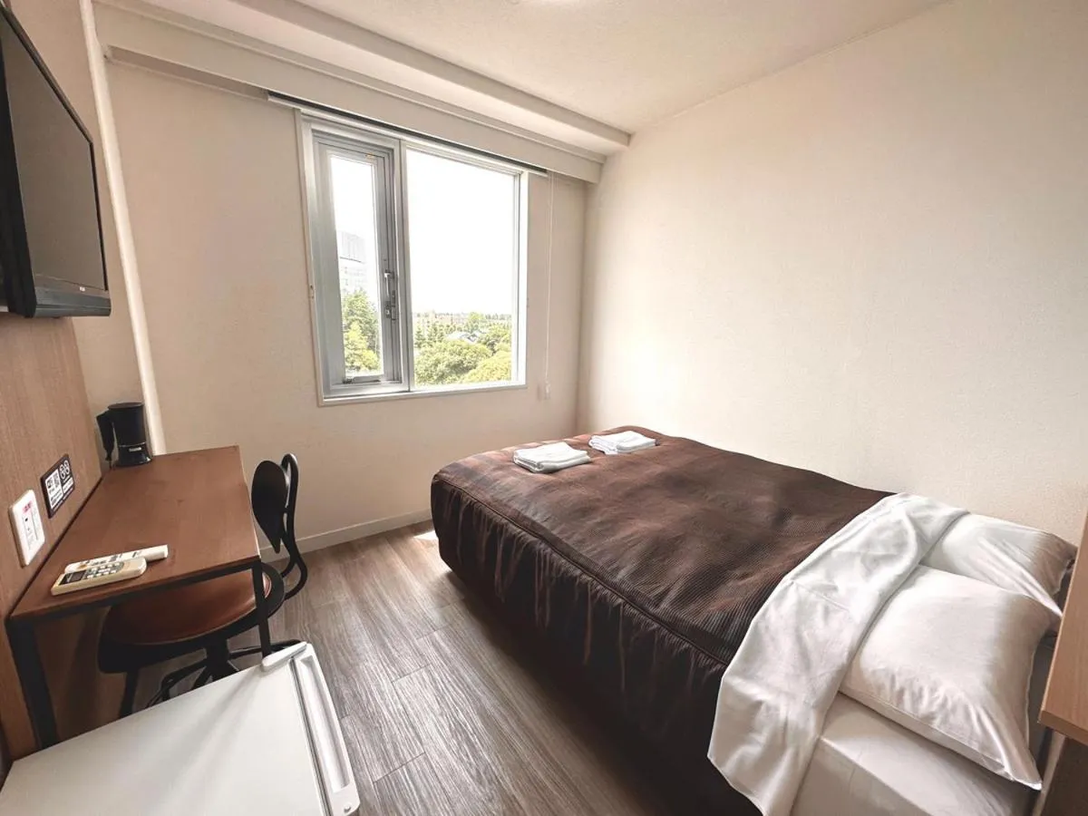 Bed in Tabist Tsukuba Sky Hotel