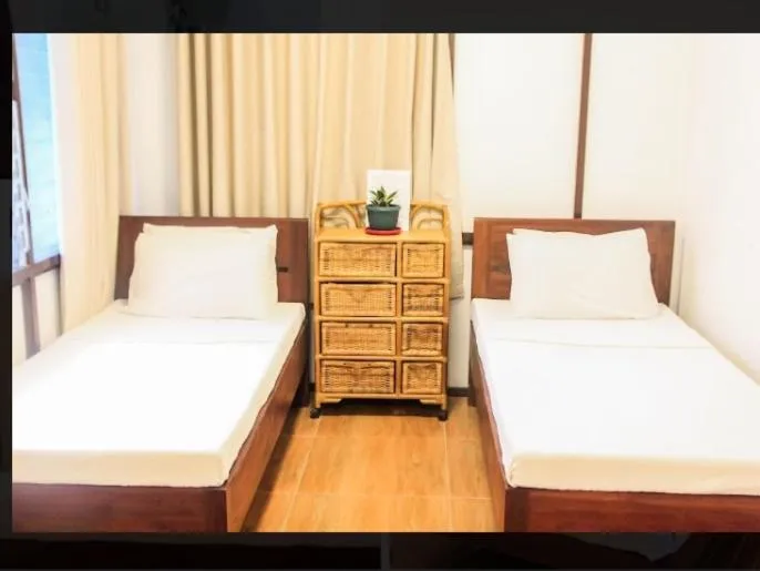 Bed in Balay 8 Suites