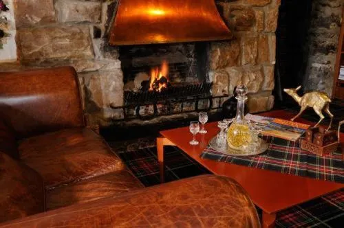 Communal lounge/ TV room in Loch Ness Lodge Hotel