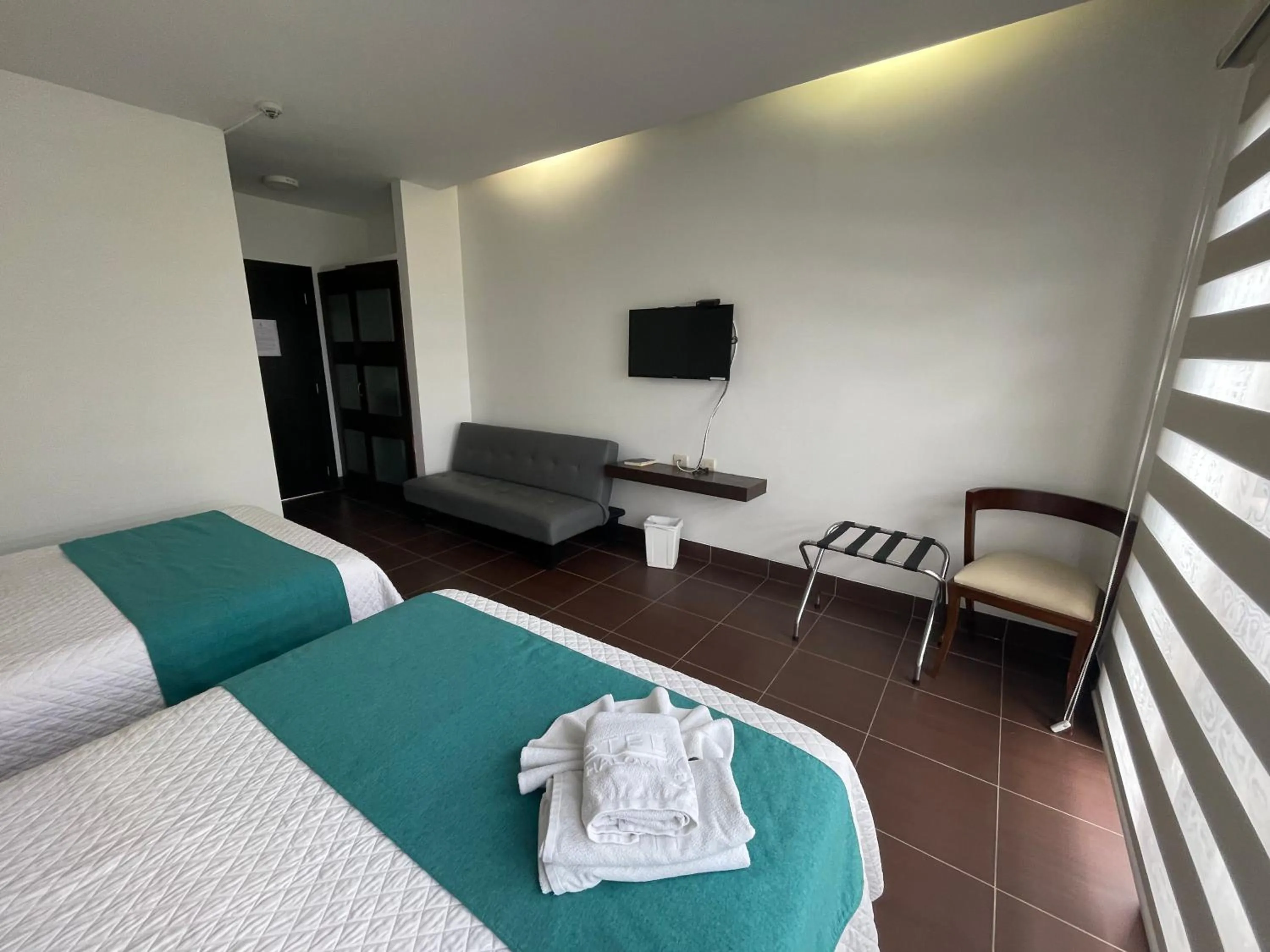 Bed in Hosteria Punta Blanca