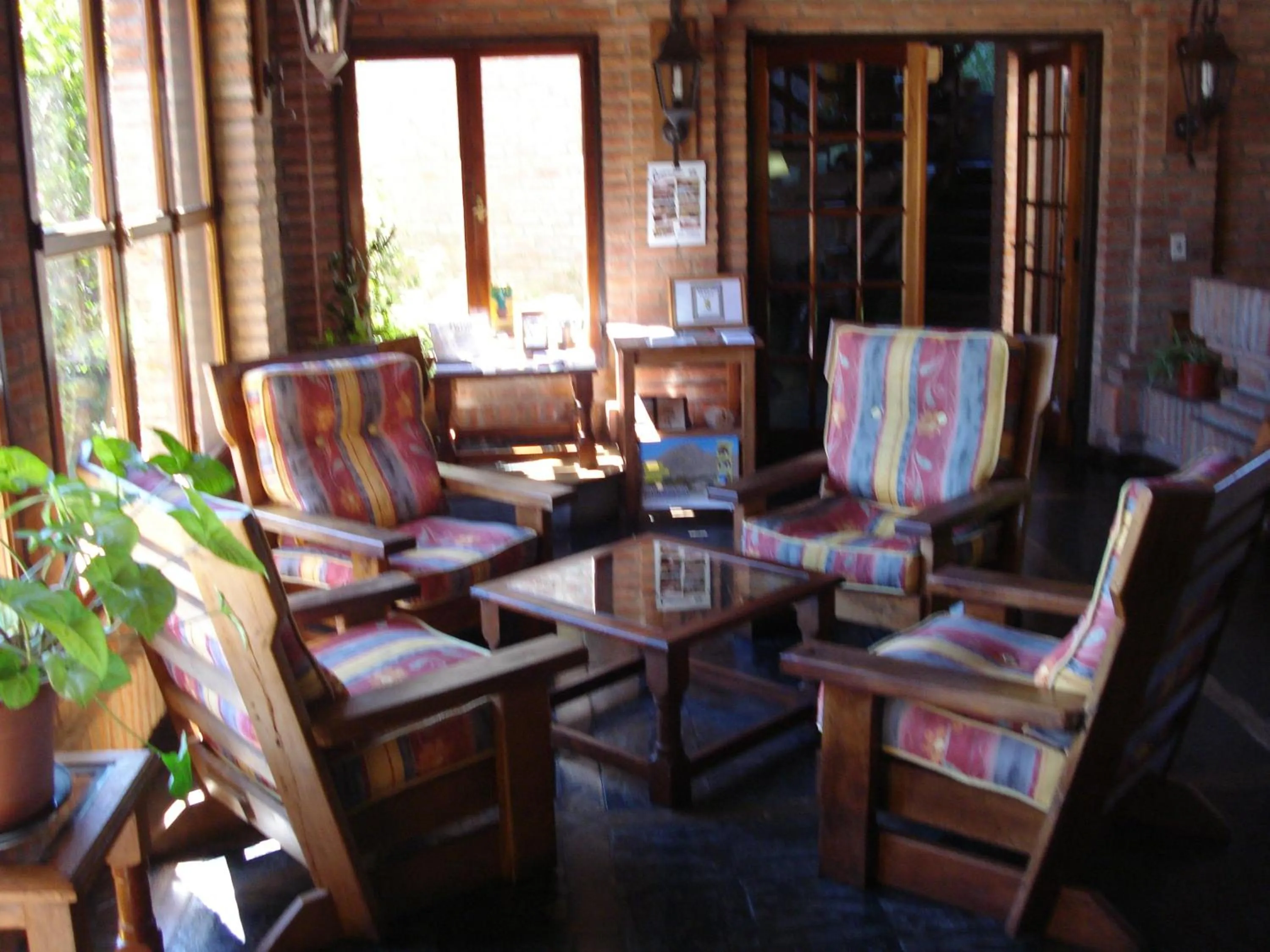 Communal lounge/ TV room in Villa de Merlo All Inclusive & Spa by MH