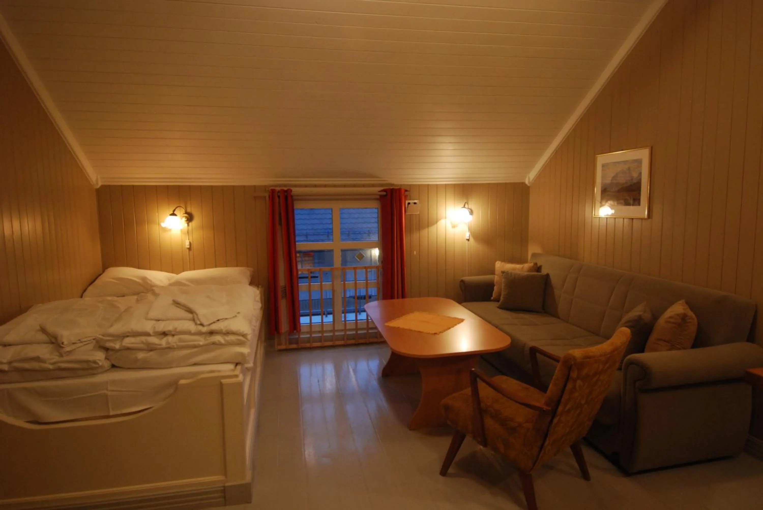 Living room, Bed in Tyskhella Rorbuer