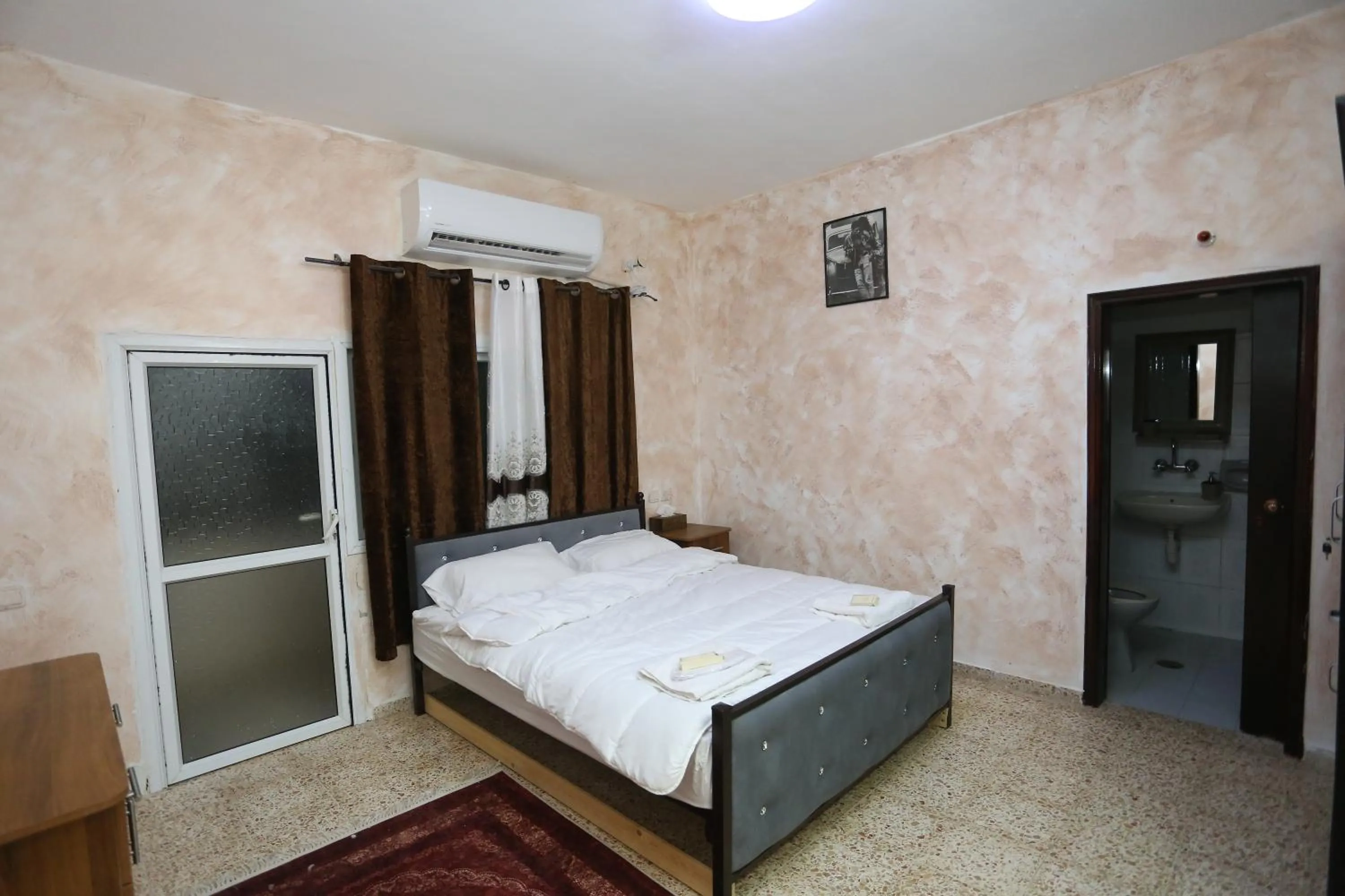 Photo of the whole room, Bed in Magtas Hotel