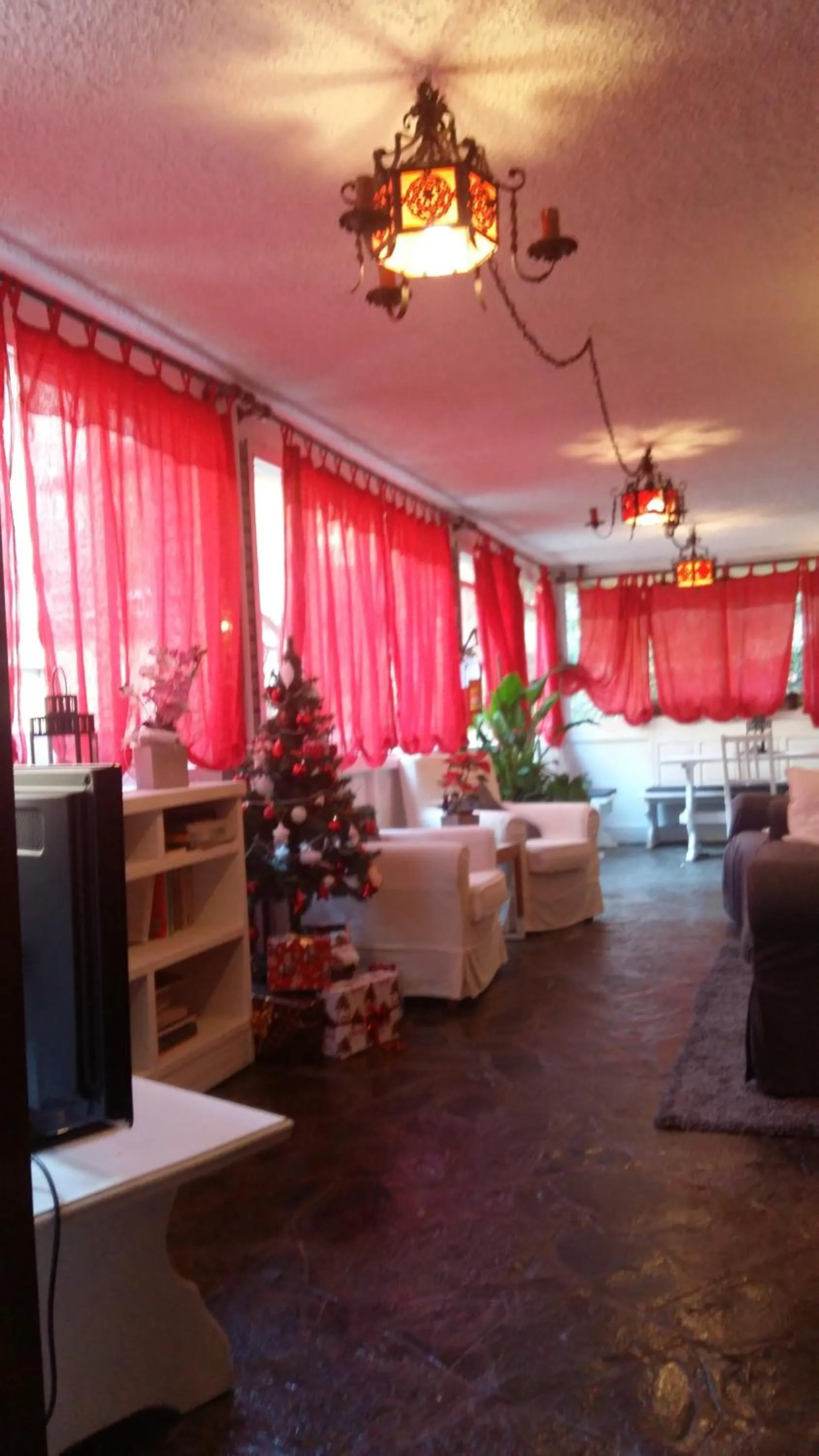 Communal lounge/ TV room in hotel Bologna