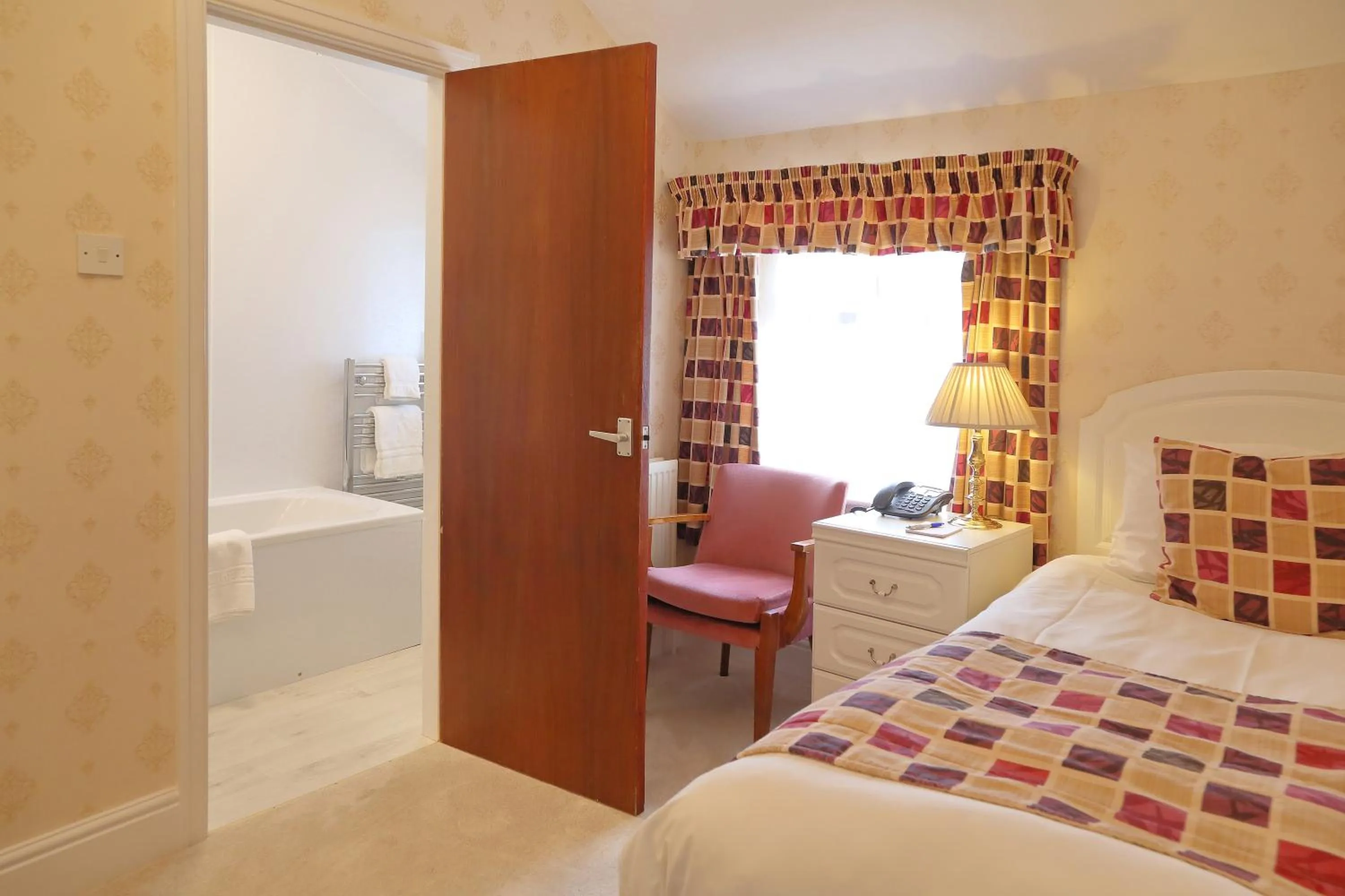 Bed in Saxonville Hotel