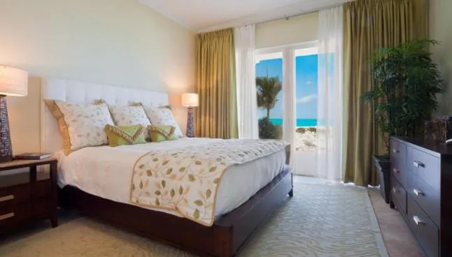 Photo of the whole room, Bed in The Venetian on Grace Bay