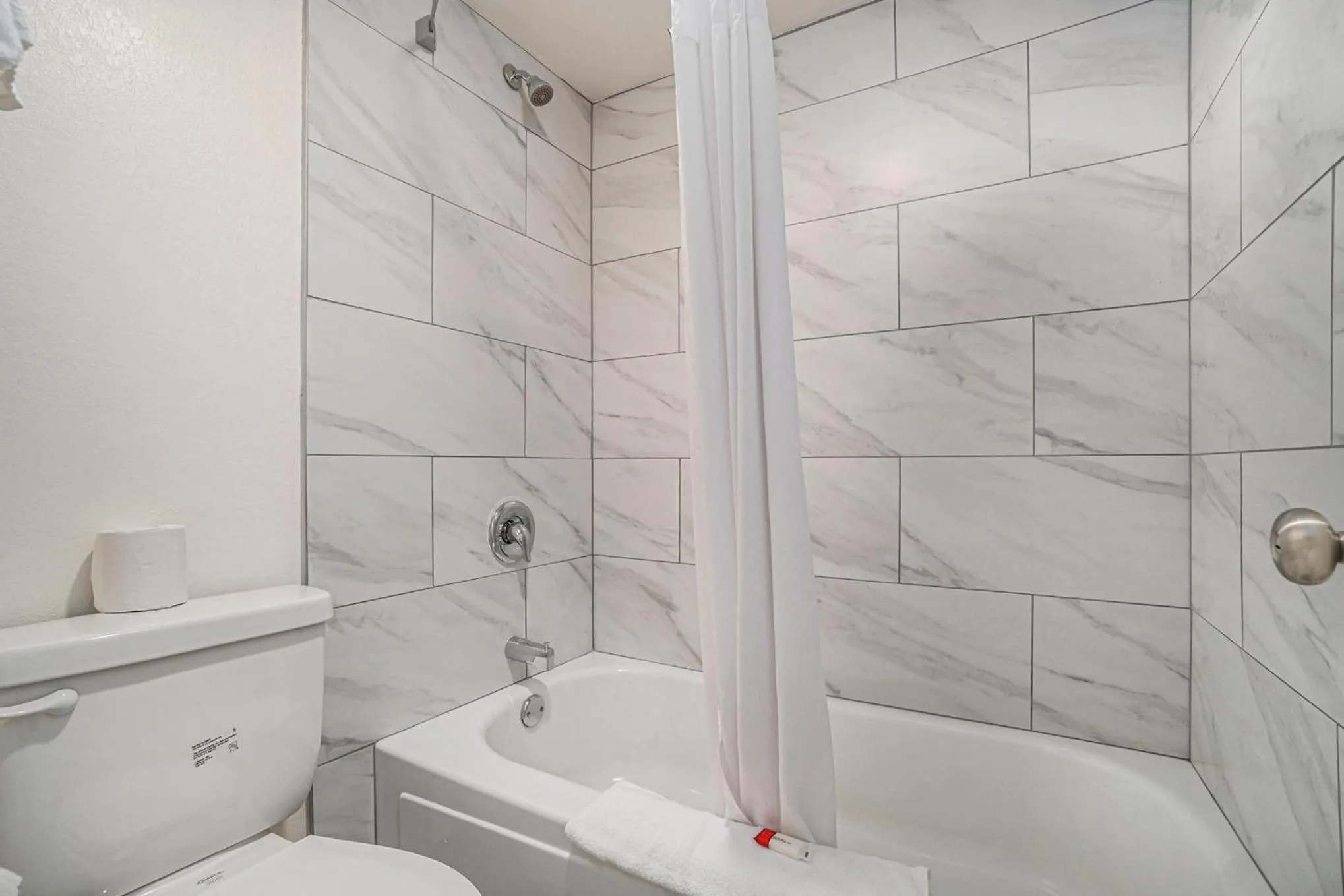 Bathroom in Travelodge by Wyndham Traverse City MI