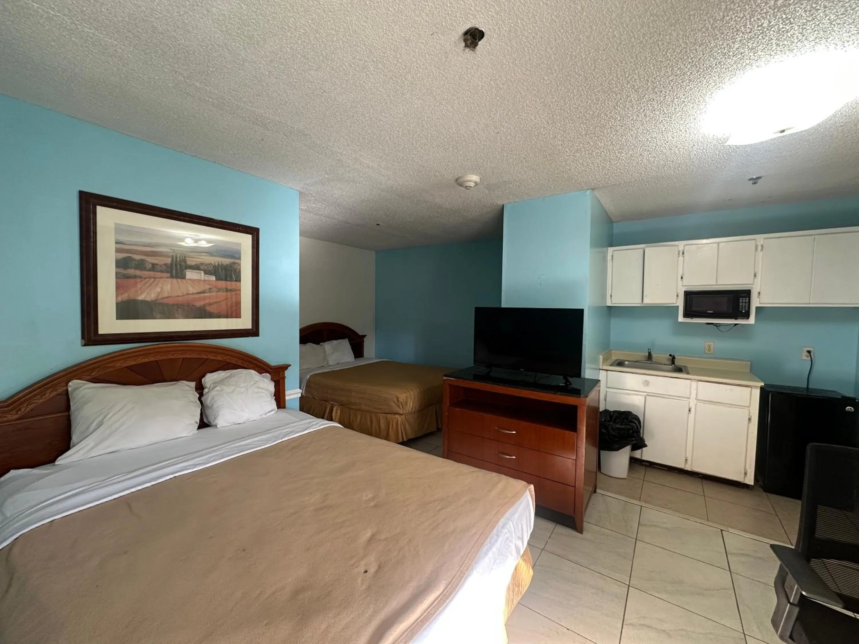 Bedroom in Guest Cottage & Suites By OYO Brunswick-Golden Isles