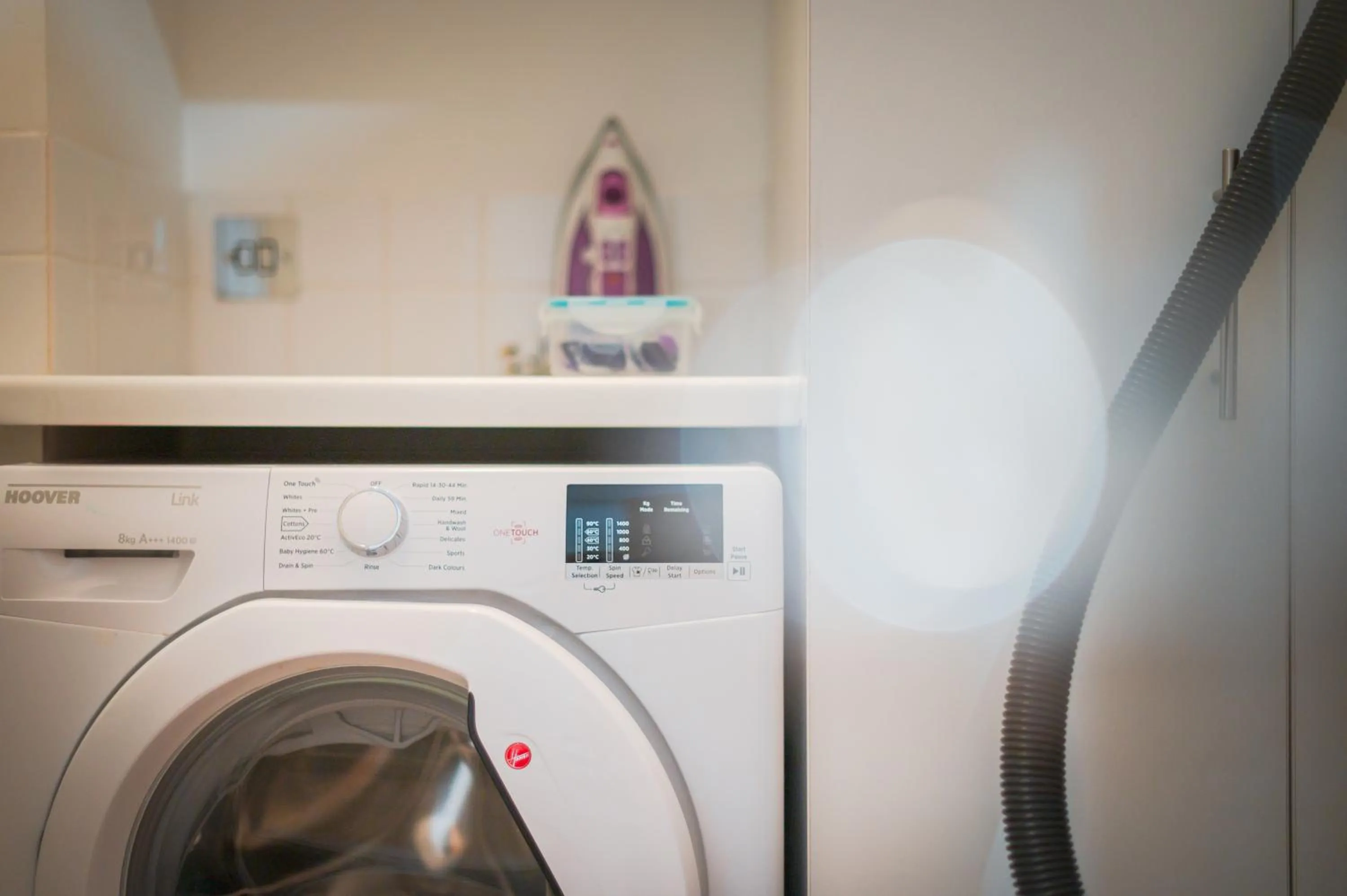 washing machine in Highland Apartments by Mansley