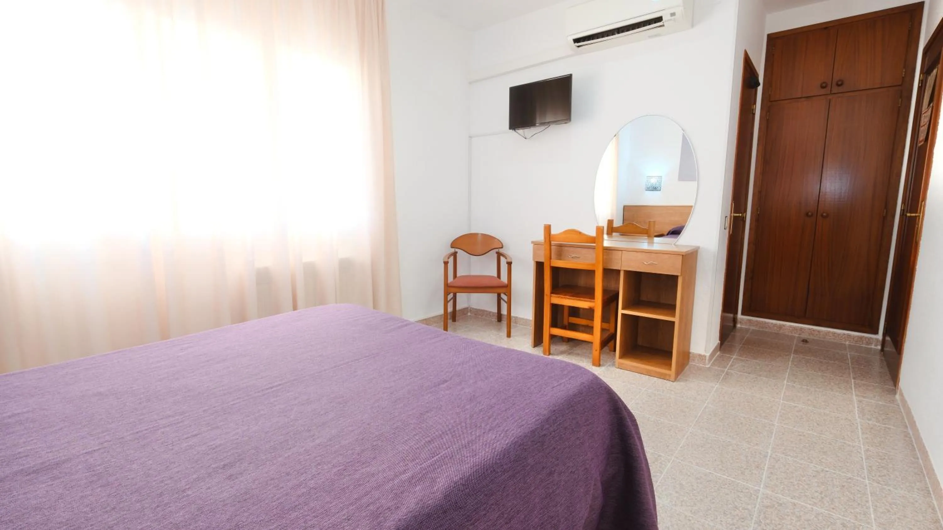 Bed in Hotel Paradís