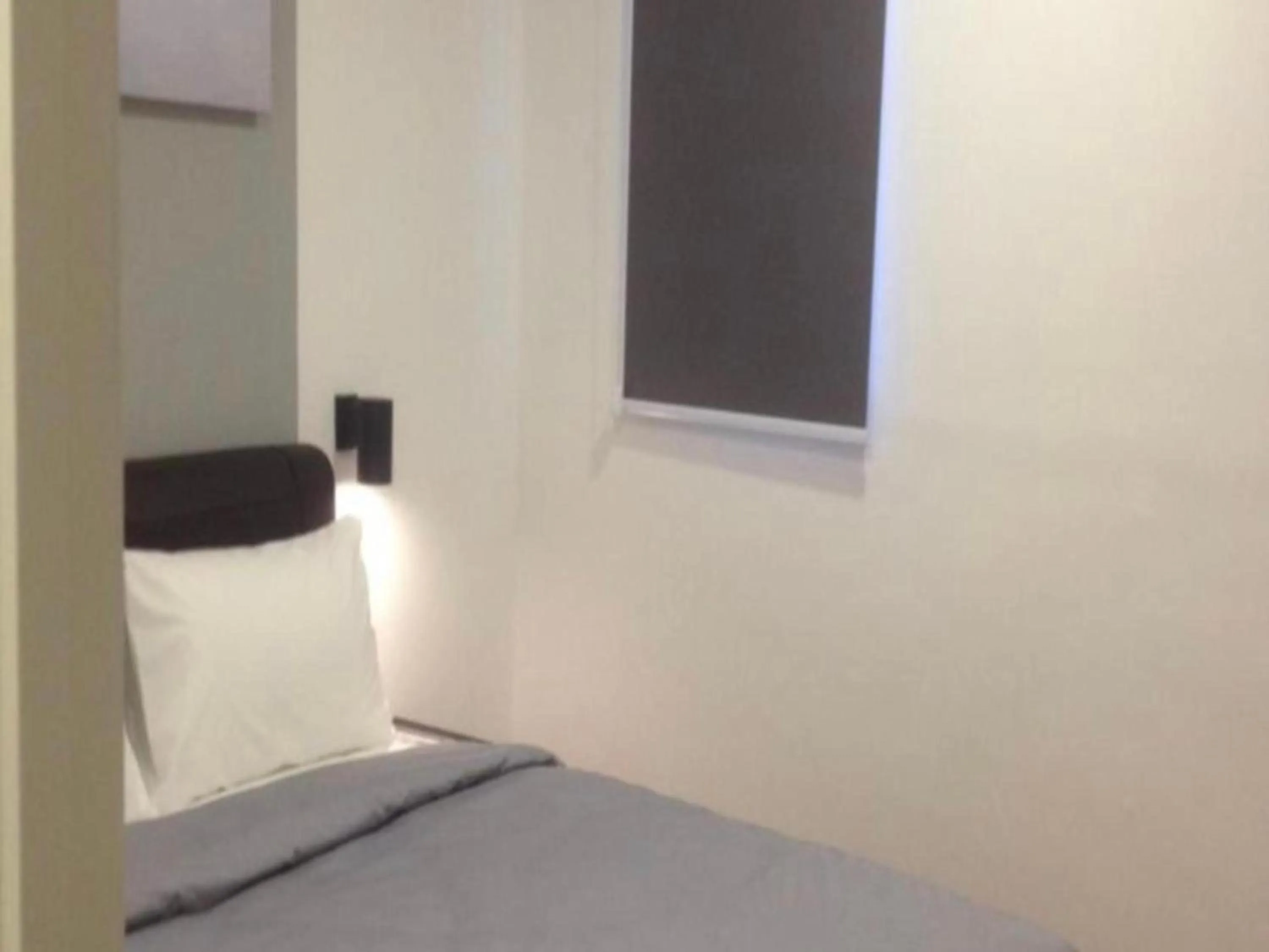 Bedroom in OYO 89492 Carlton Inn Bukit Ubi