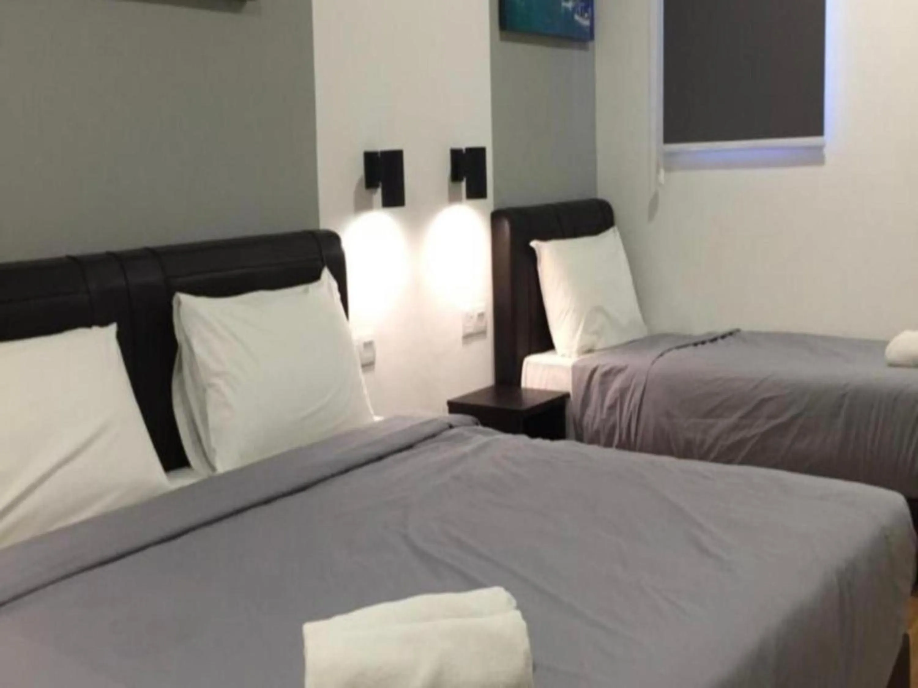 Bedroom in OYO 89492 Carlton Inn Bukit Ubi