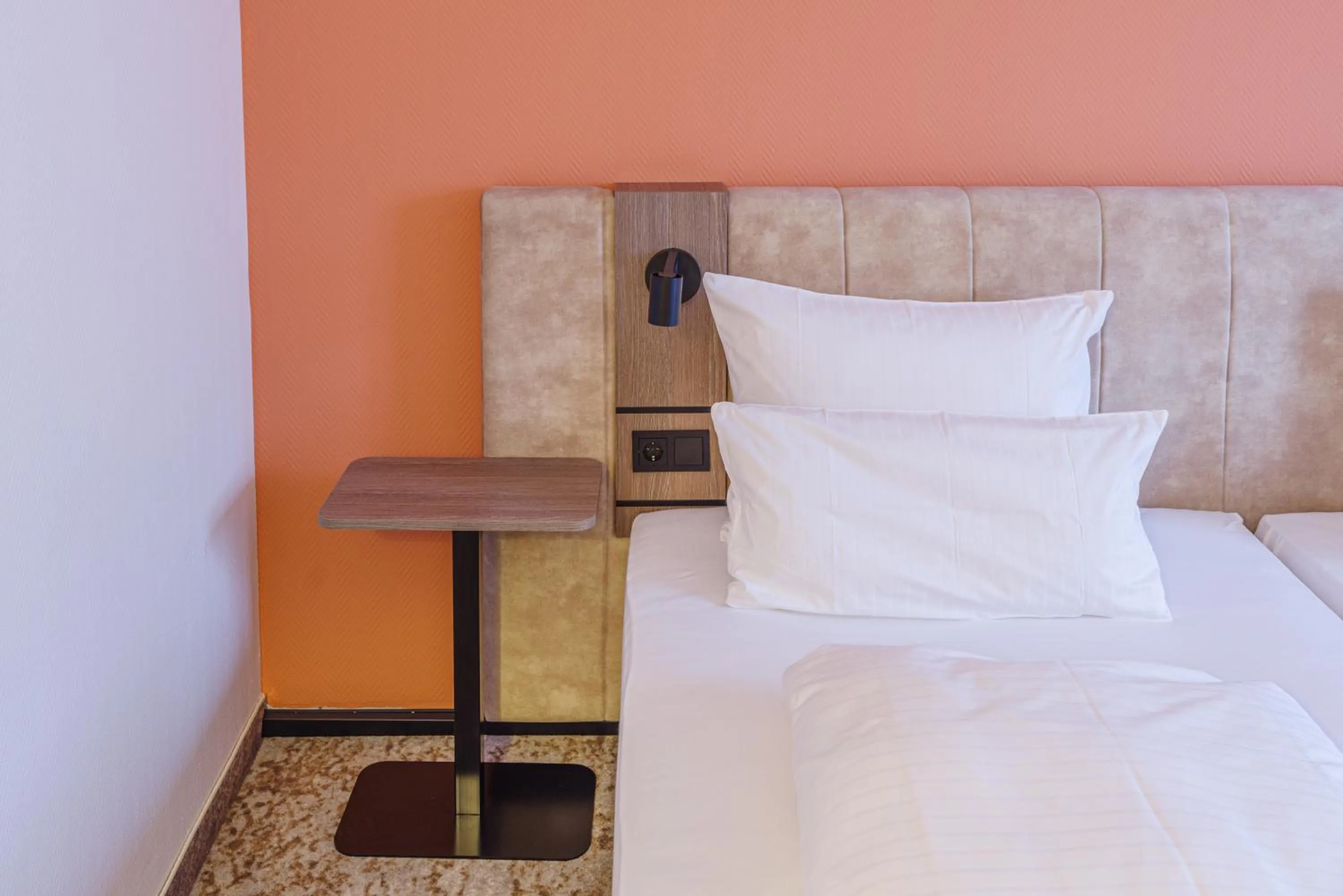 Bed in Atomis Hotel Munich Airport by Mercure