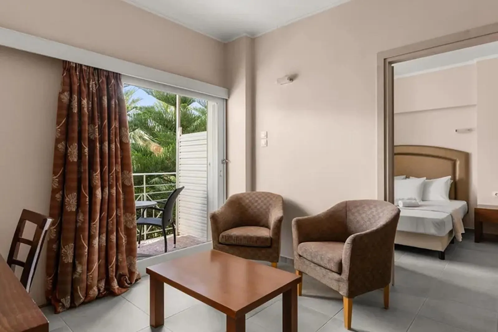 Photo of the whole room, Bed in Calamos Beach Family Club