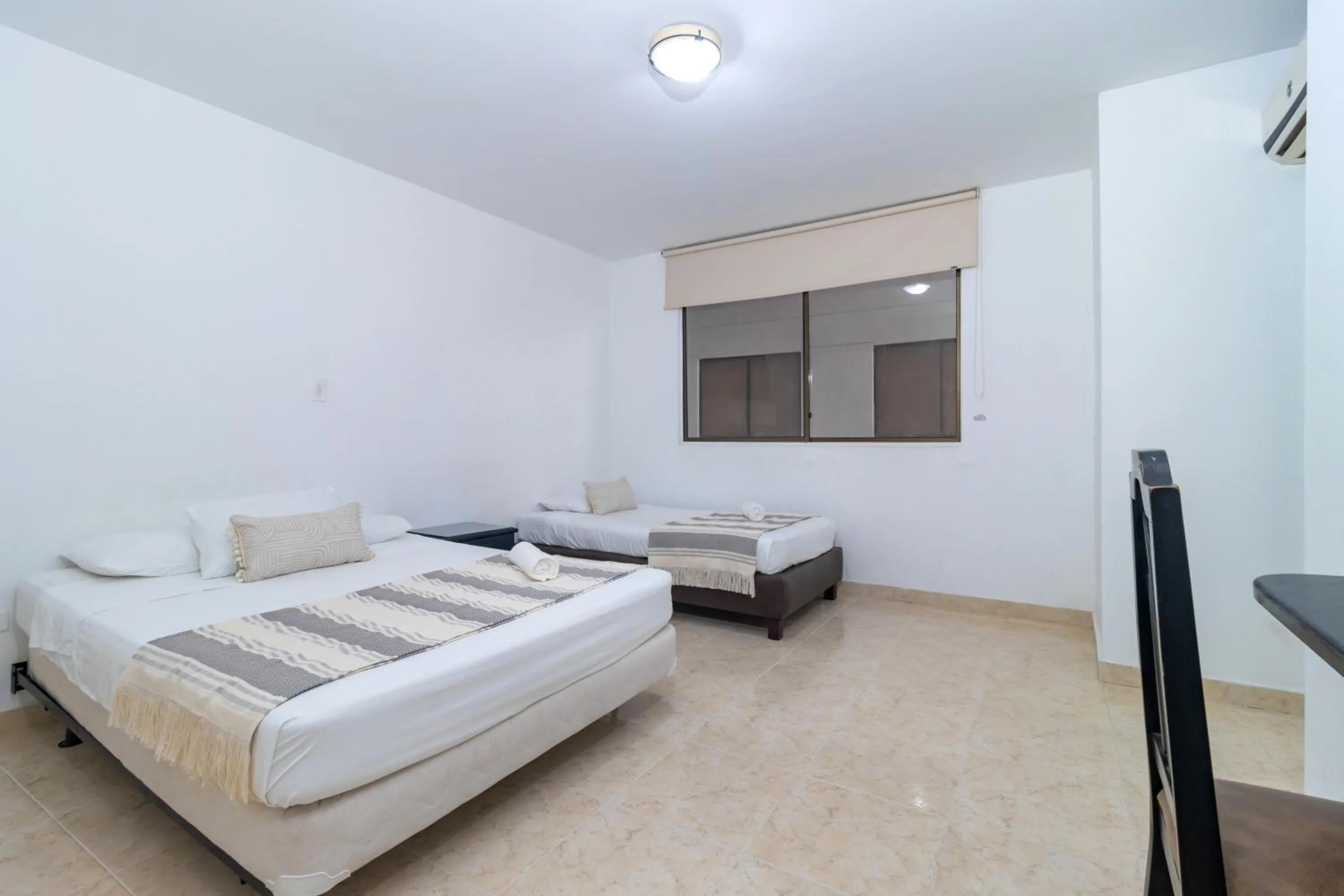 Bed in Hotel Axis Inn By GEH Suites