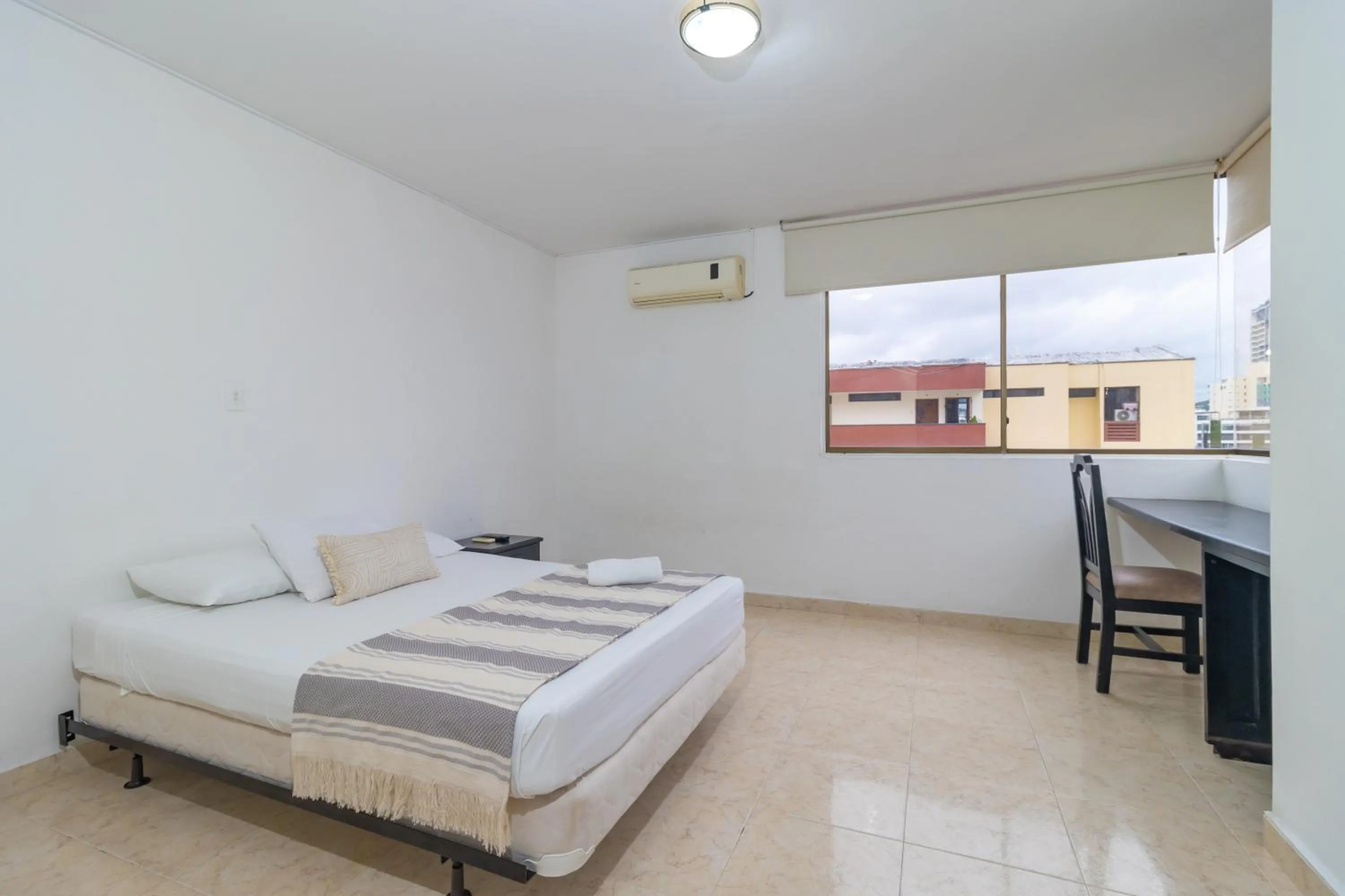 Bed in Hotel Axis Inn By GEH Suites