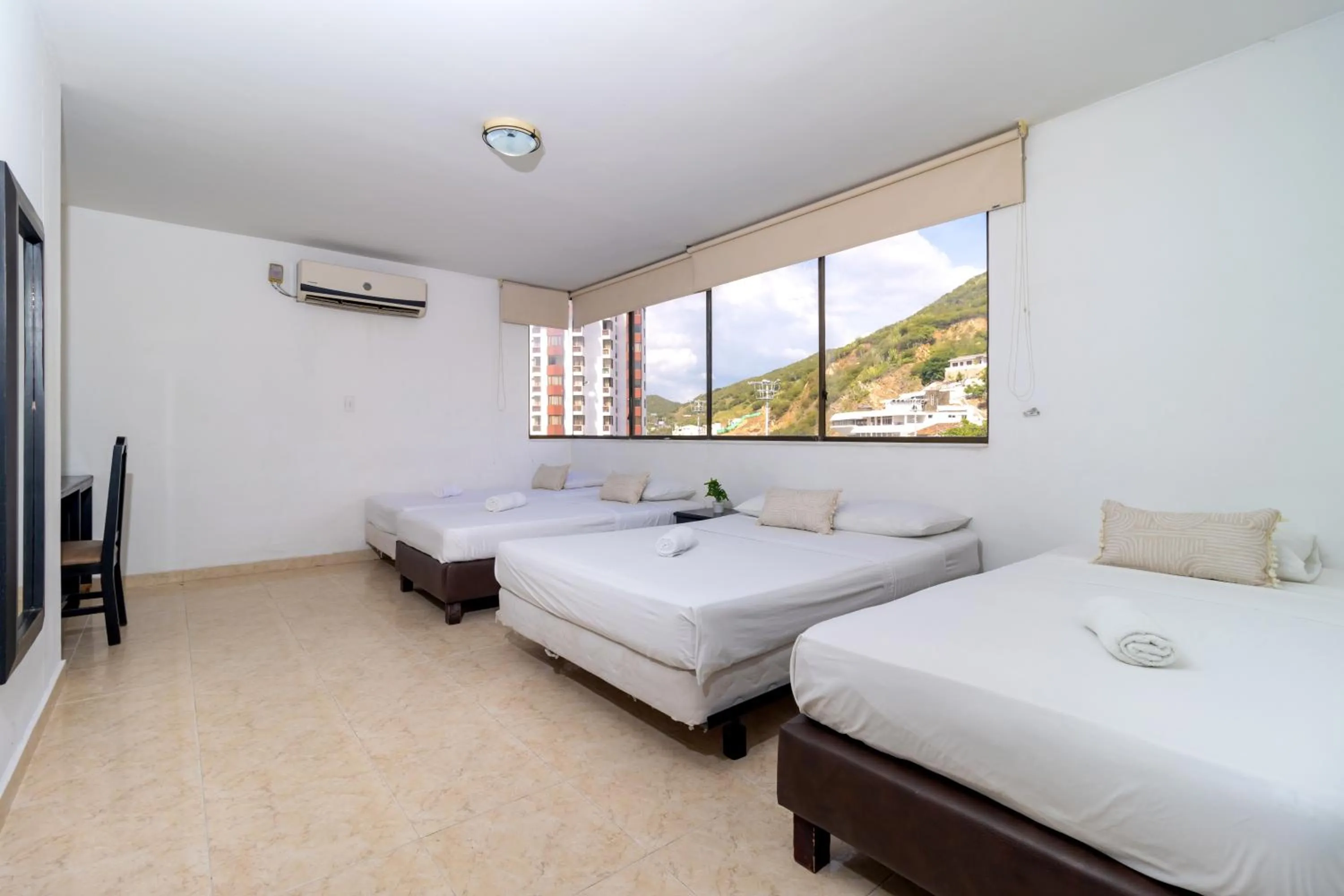 Bed in Hotel Axis Inn By GEH Suites