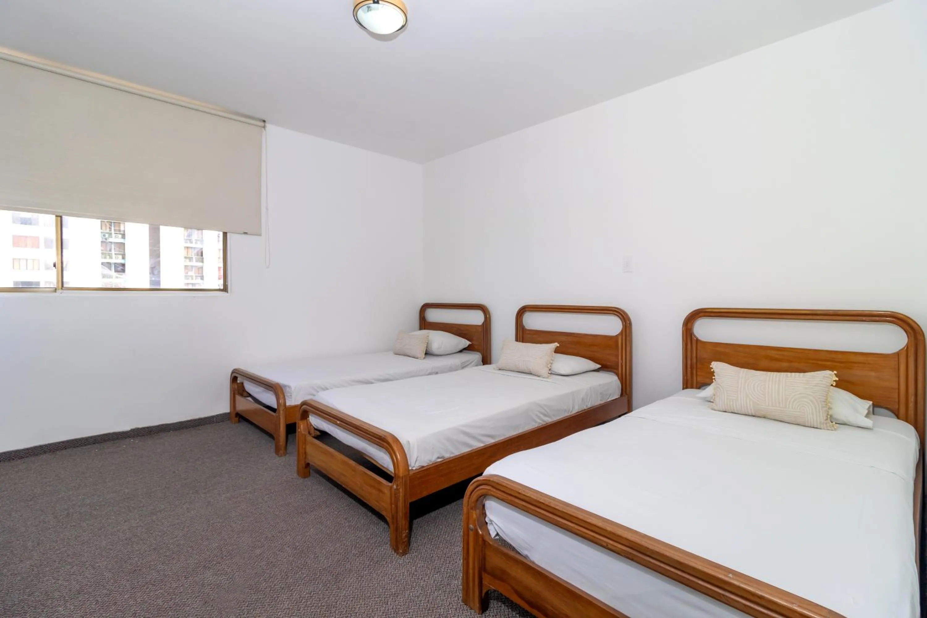 Bed in Hotel Axis Inn By GEH Suites