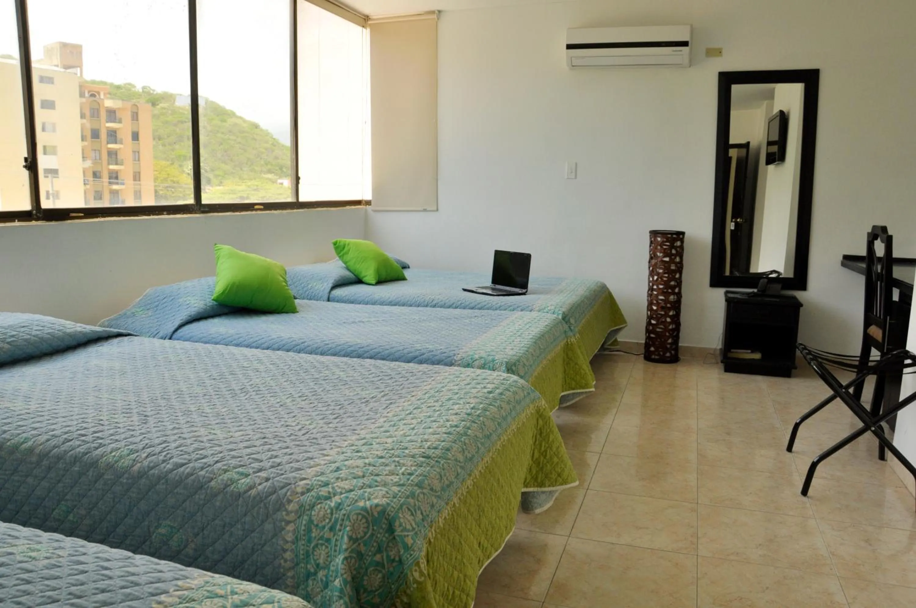 Bed in Hotel Axis Inn By GEH Suites